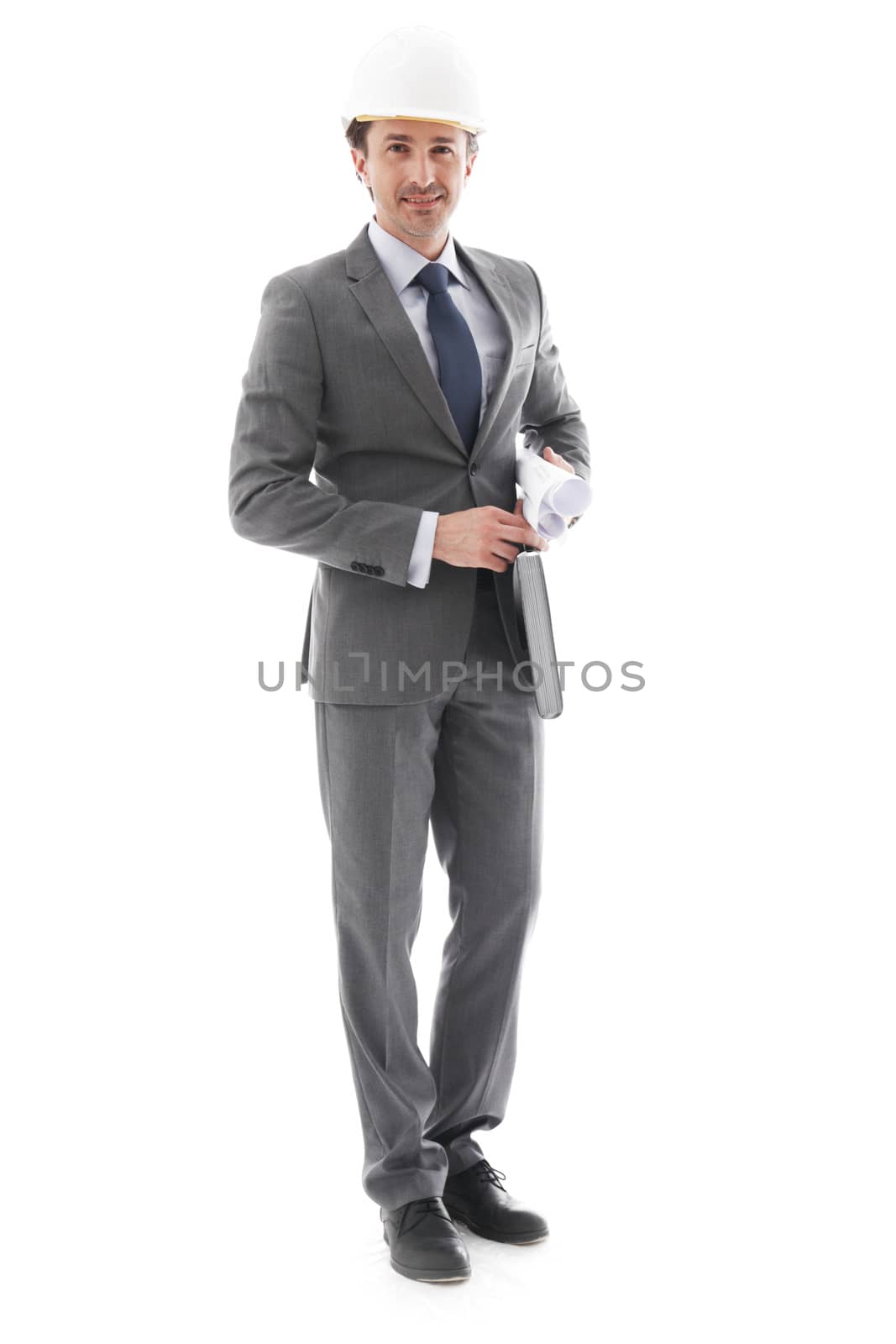 Young businessman in helmet isolated on white background