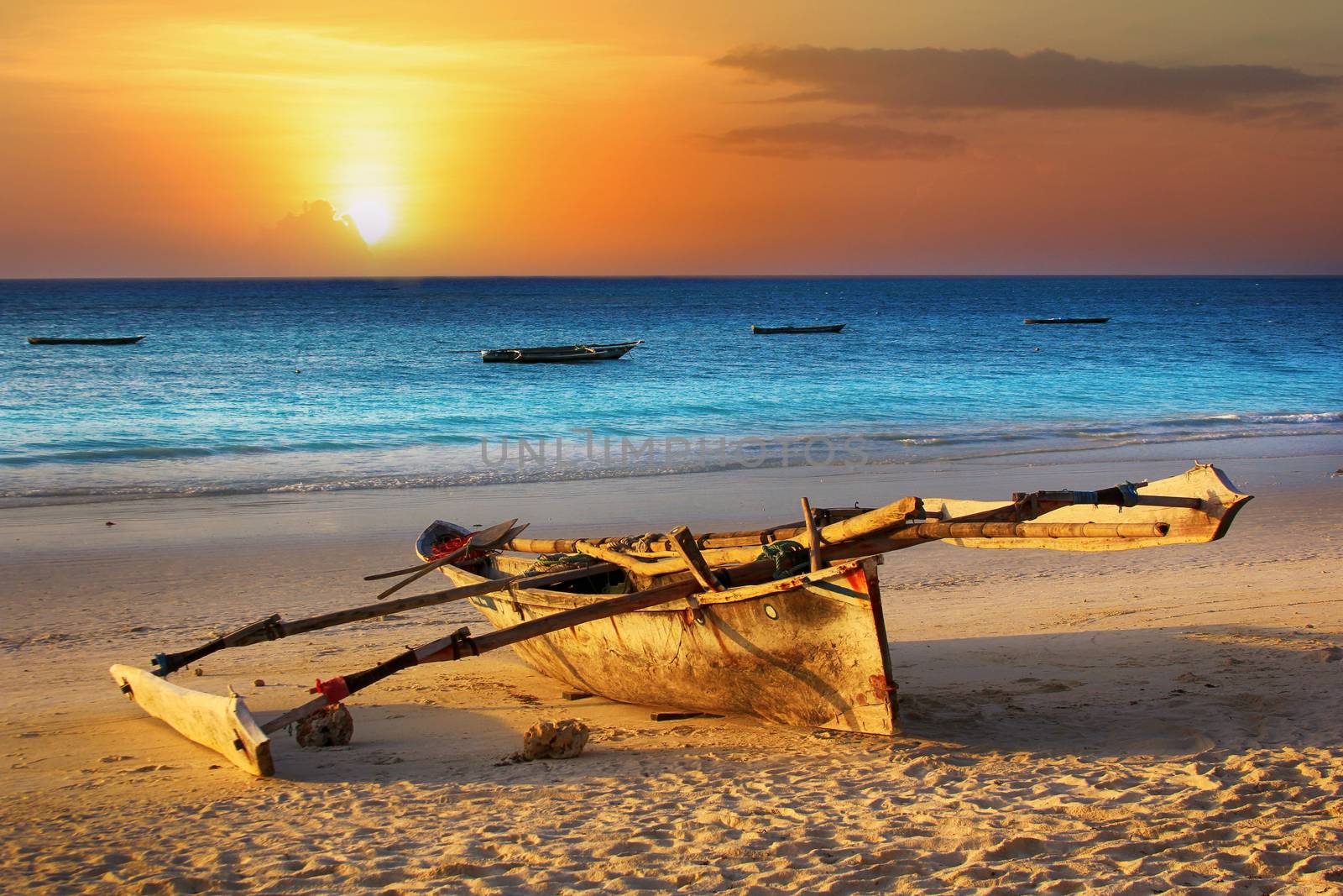 Traditional fishing boat on the ocean at sunset. Zanzibar by friday