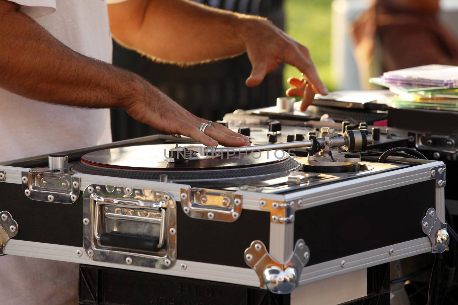 Turntable, hand of dj on the vinyl record on Venice Beach. California, USA