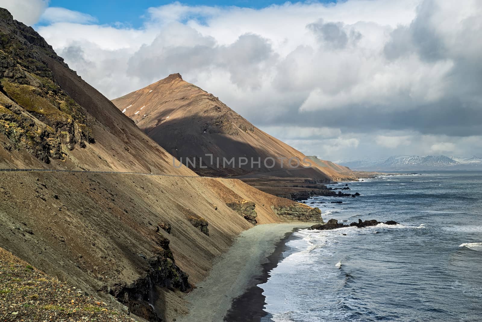 Krossnesfjall mountain on the eastside of Iceland in front of the ocean