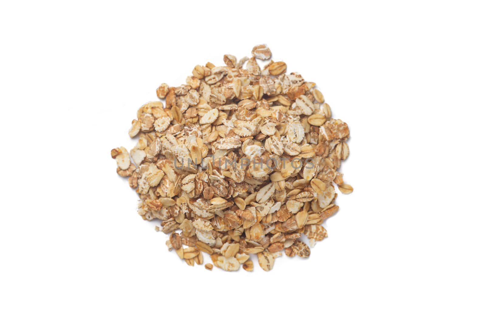 A bunch of cereal granola flakes isolated on white background. Stock photo of healty diet ingredients. Concept of vegan and vegetarian healty food.