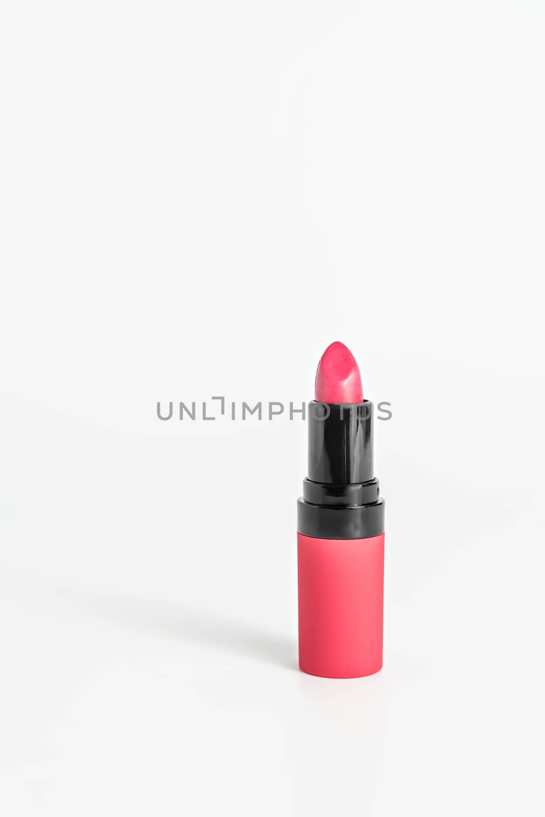 close up Pink color lipstick on white background