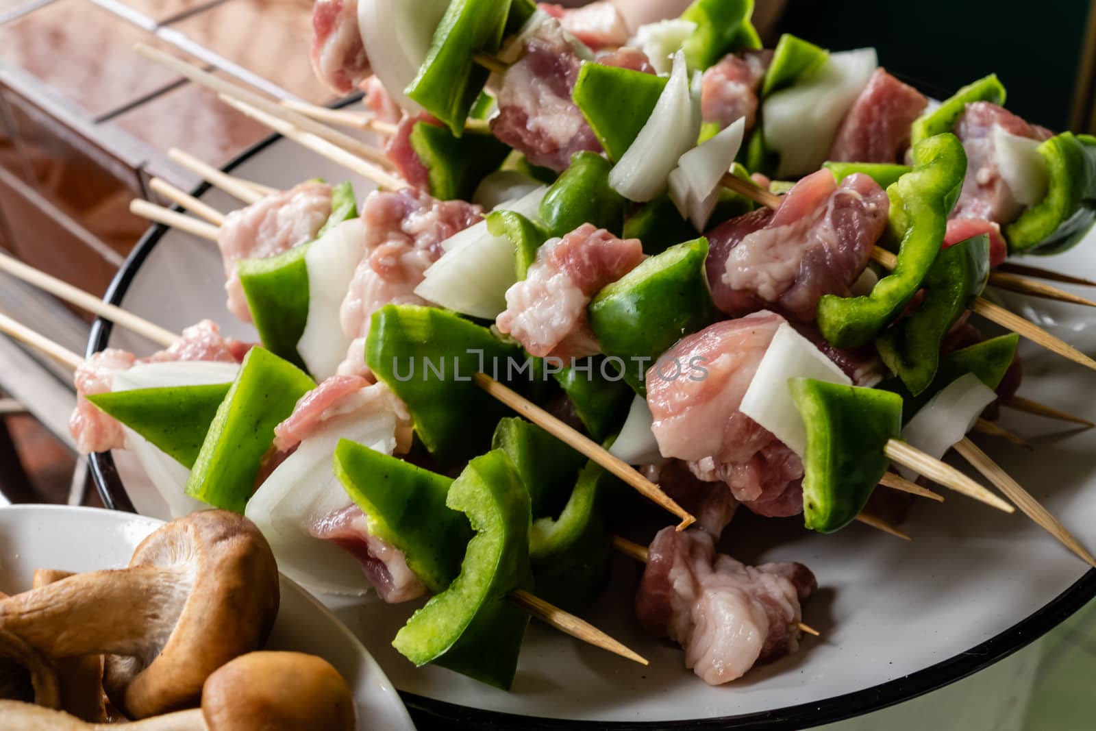 Green pepper and pork kebabs in bowl