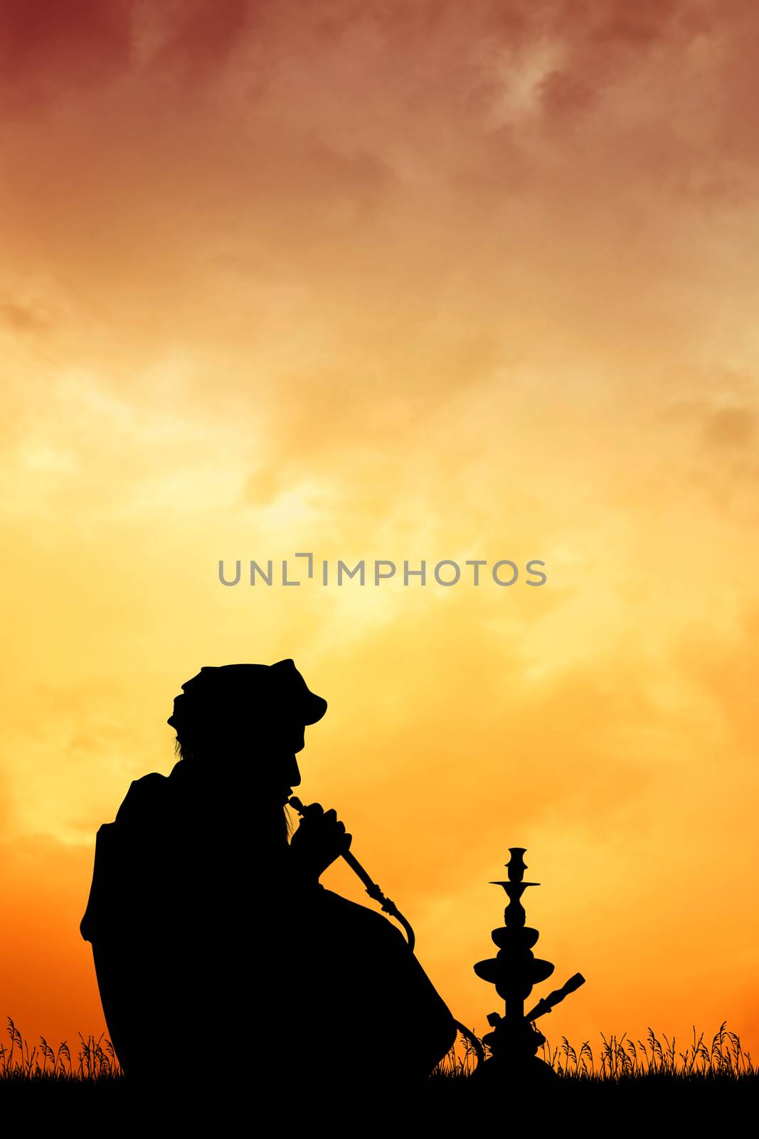 illustration of Muslim man smoke hookah silhouette at sunset