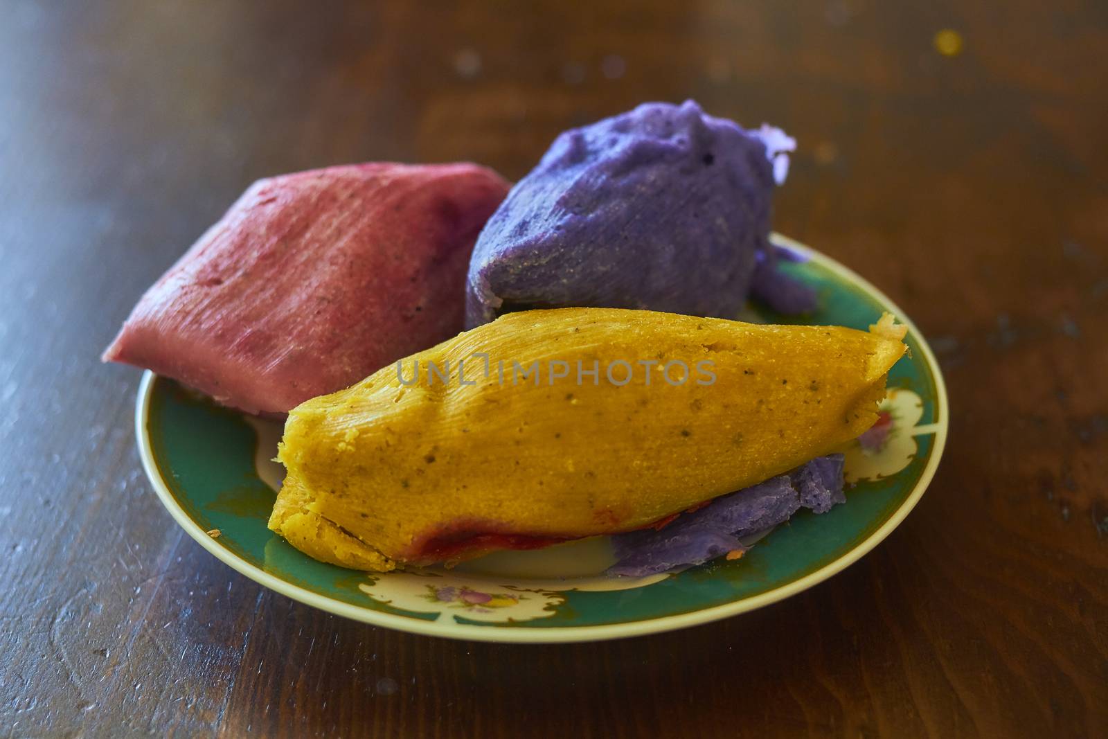 Corn tamales in colors, traditional Mexican food, sweet and chili flavors