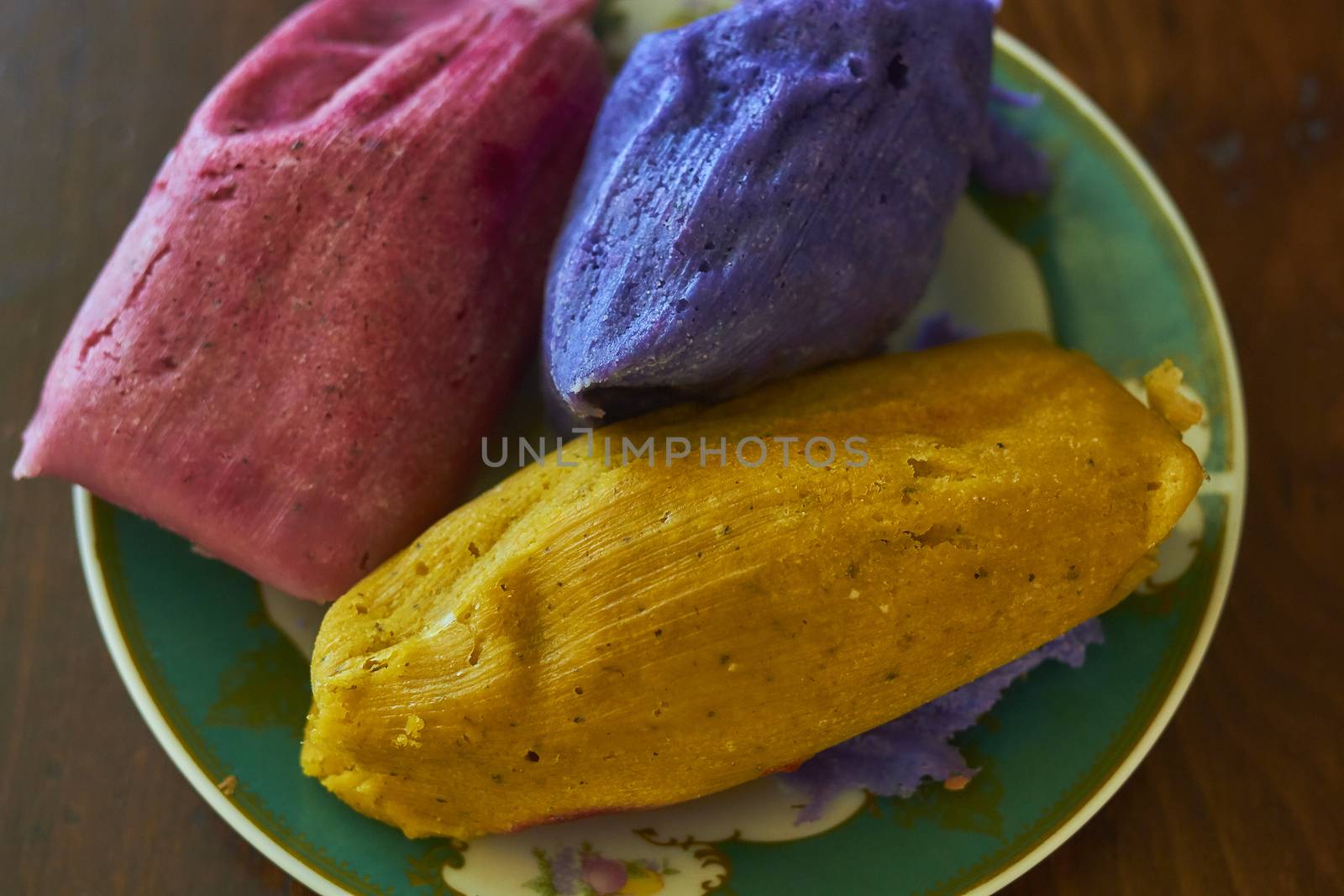 Corn tamales in colors, traditional Mexican food, sweet and chili flavors