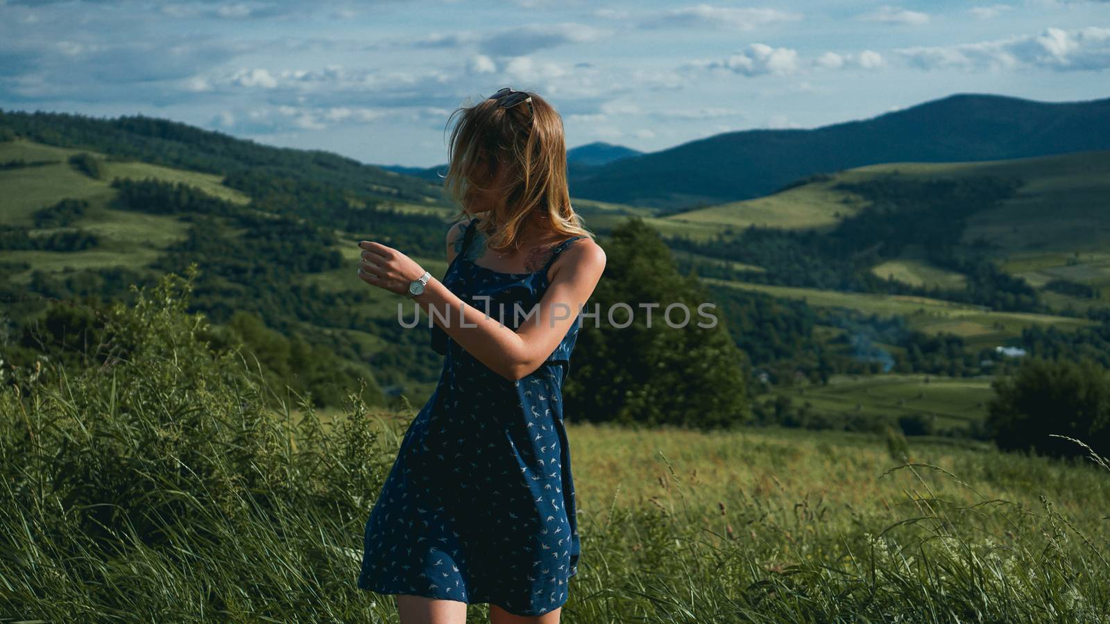 Happy Woman in mountains at sunny day time by natali_brill