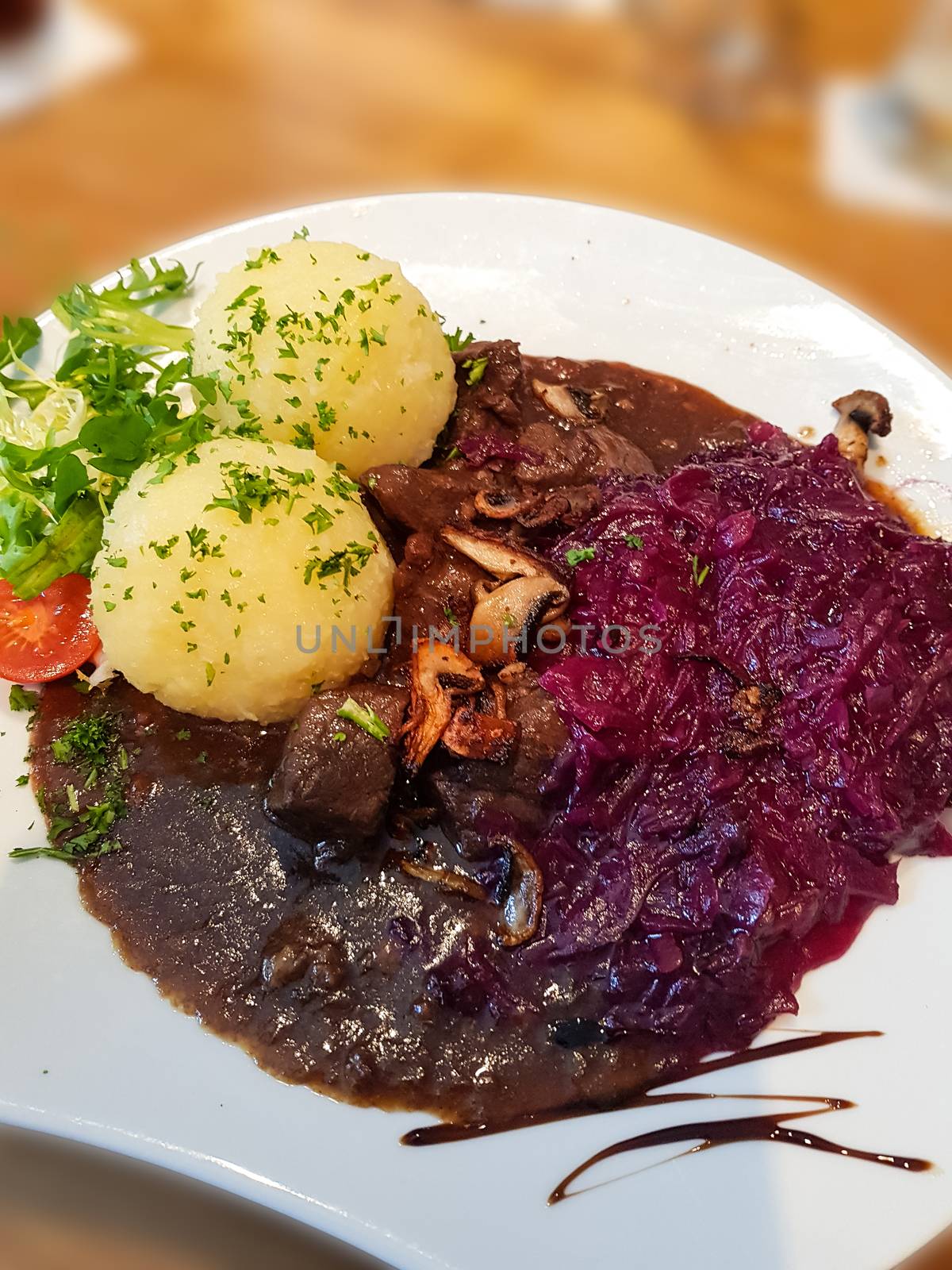 Gourmet game fillet with potato dumplings, goulash garnished