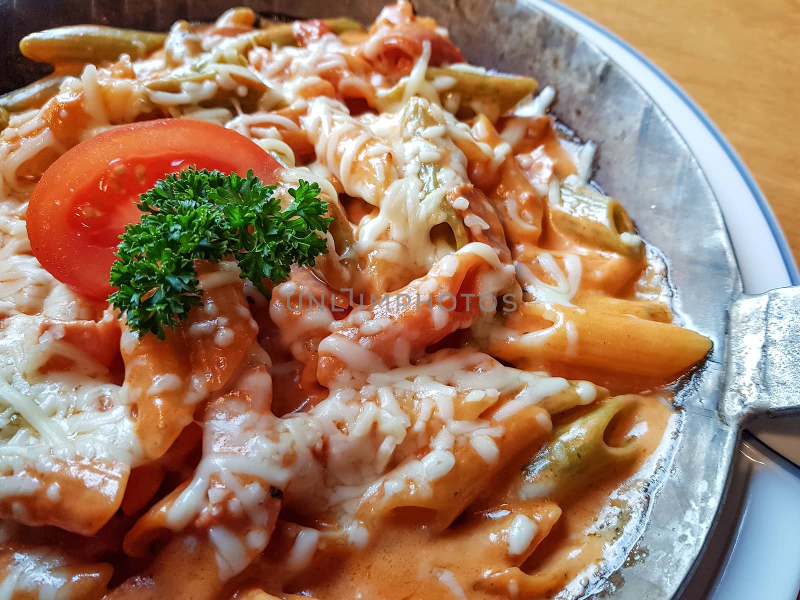 Pasta dish with fresh tomato sauce, mozzarella and basil