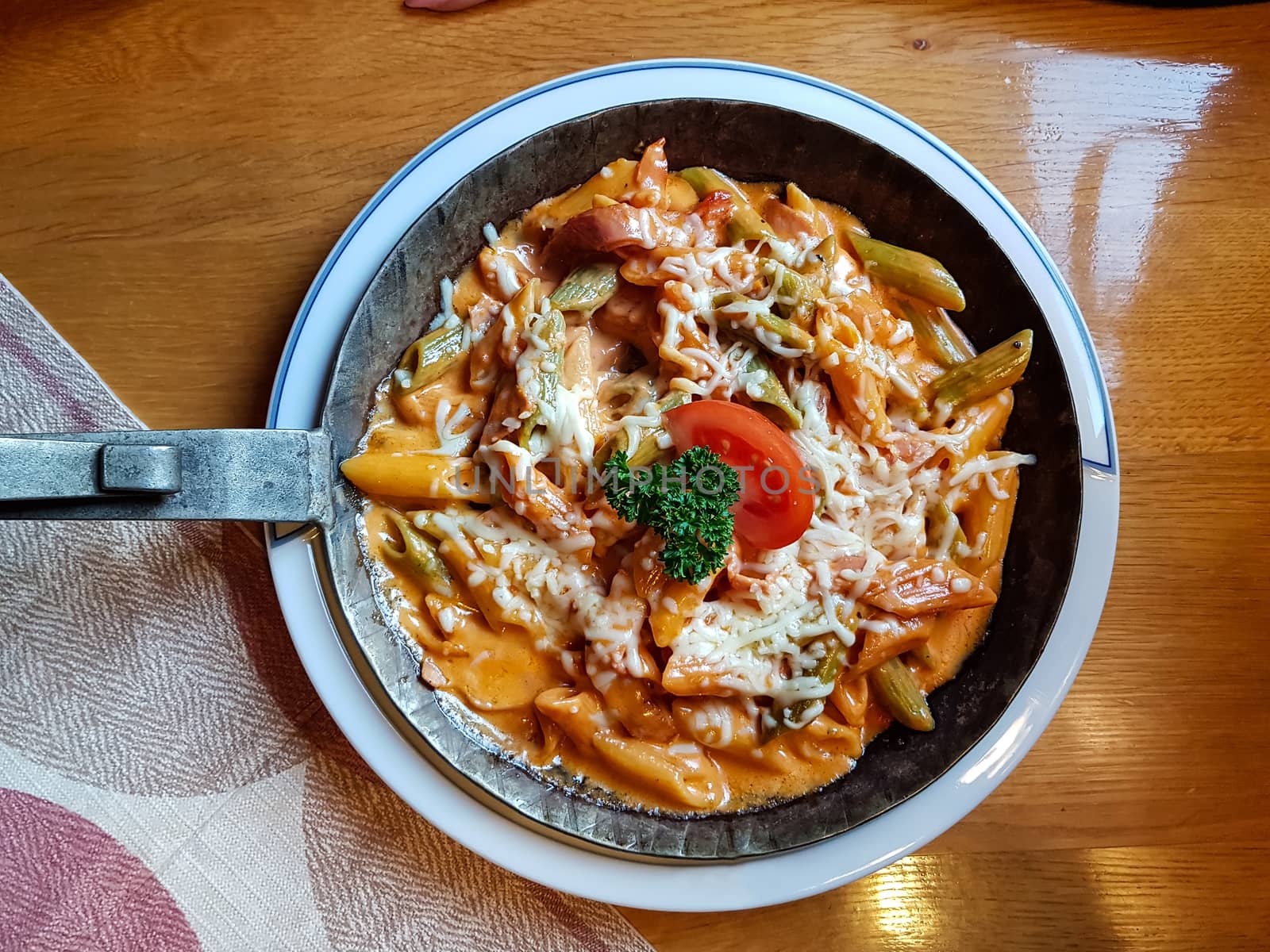 Pasta dish with fresh tomato sauce, mozzarella and basil