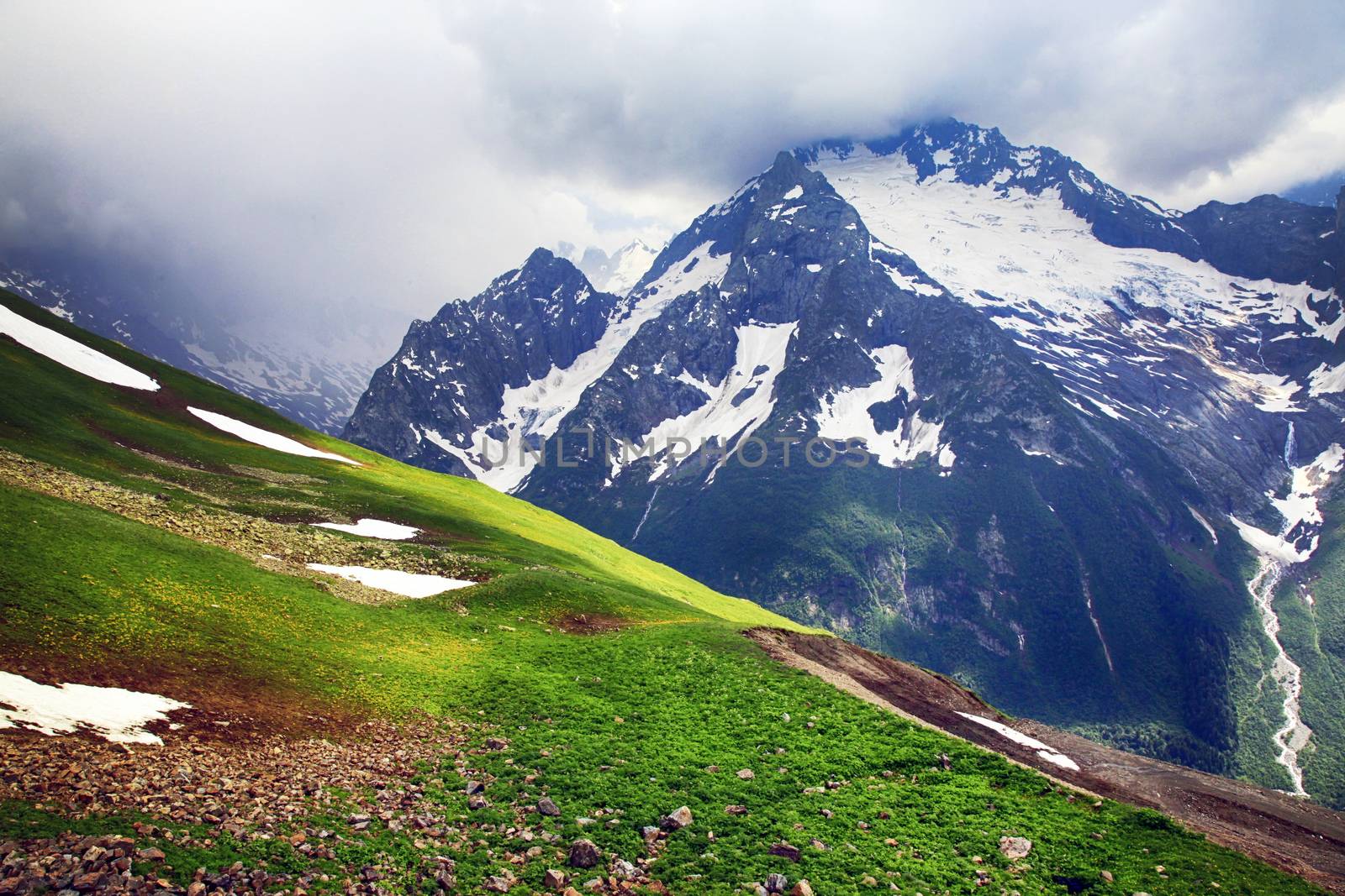 Panorama of mountains scene with dramatic blue sky in national park of Dombay