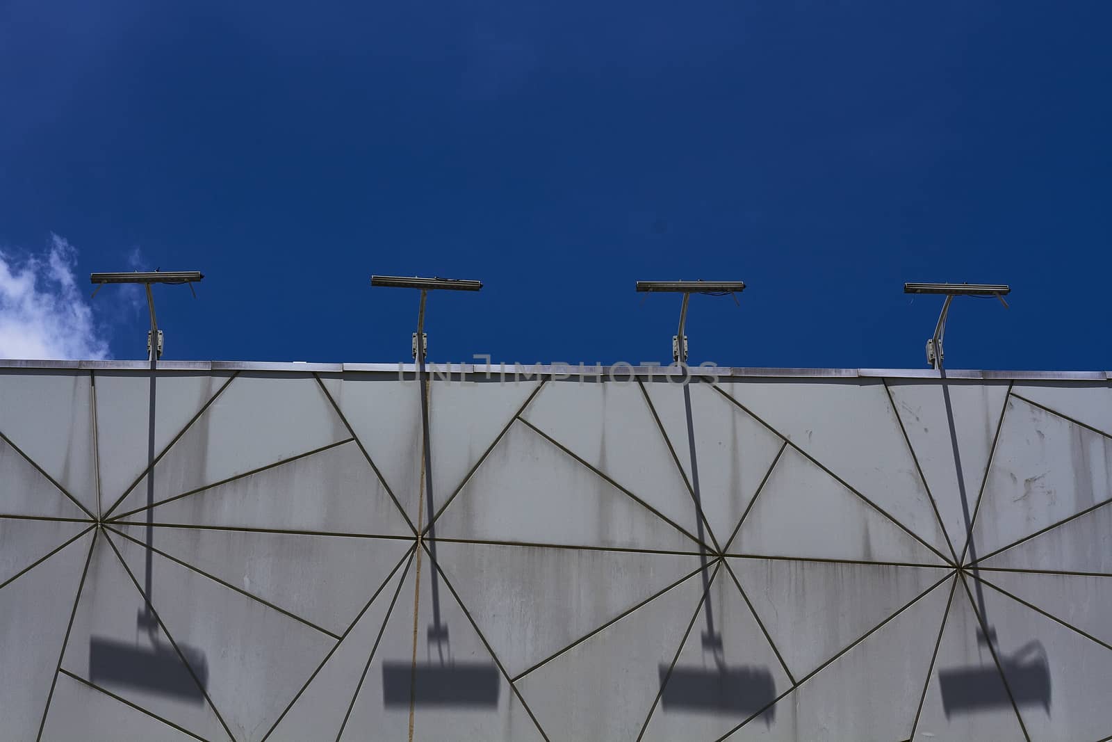 repeating concrete structure and blue sky