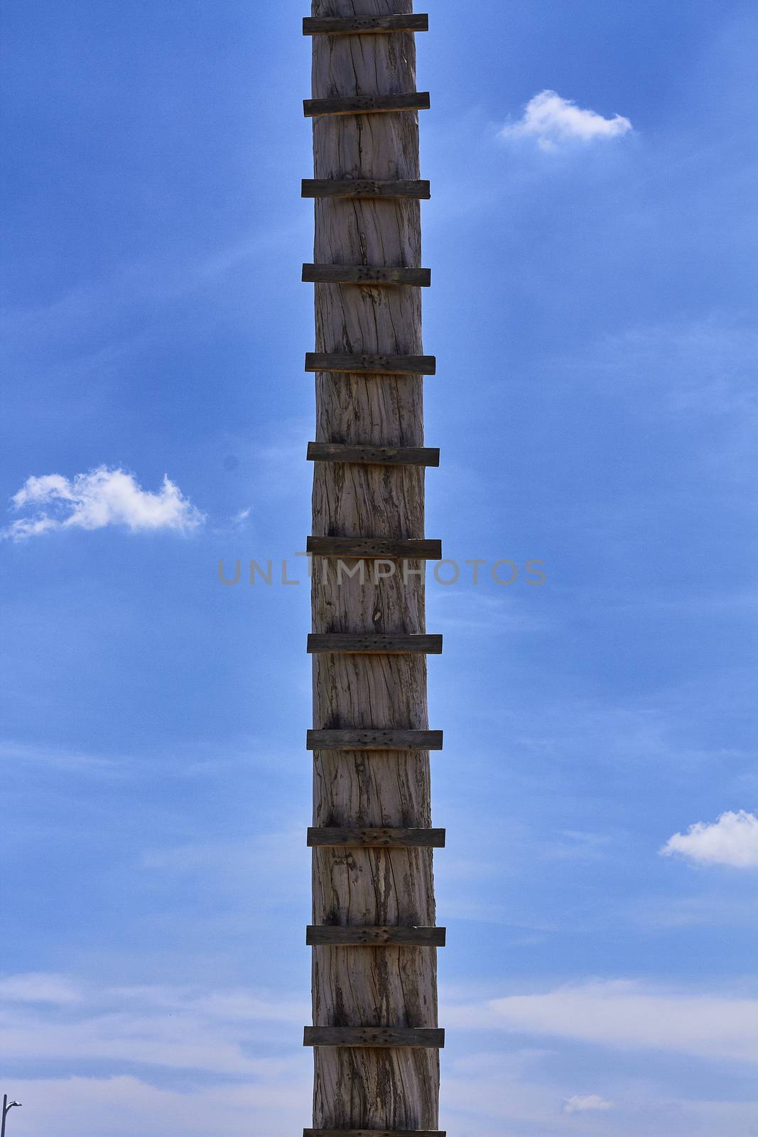 rustic wooden staircase, blue sky and clouds