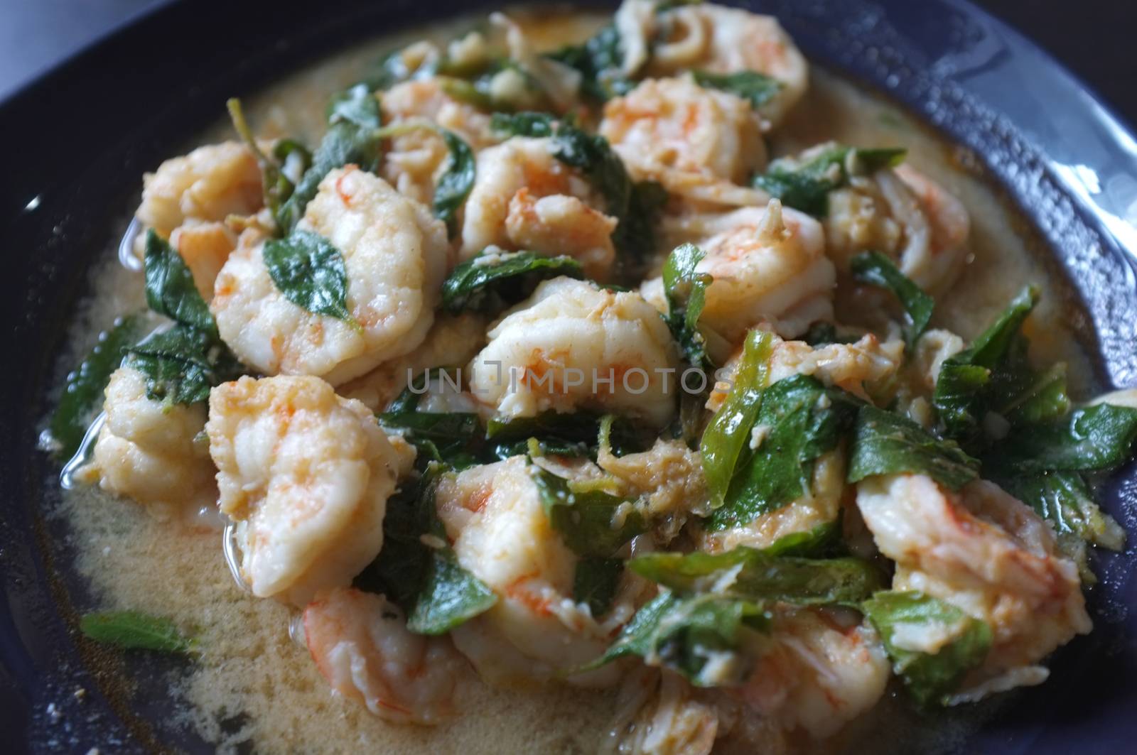 Thai food, shrimp ,with chili pepper and Thai basil.