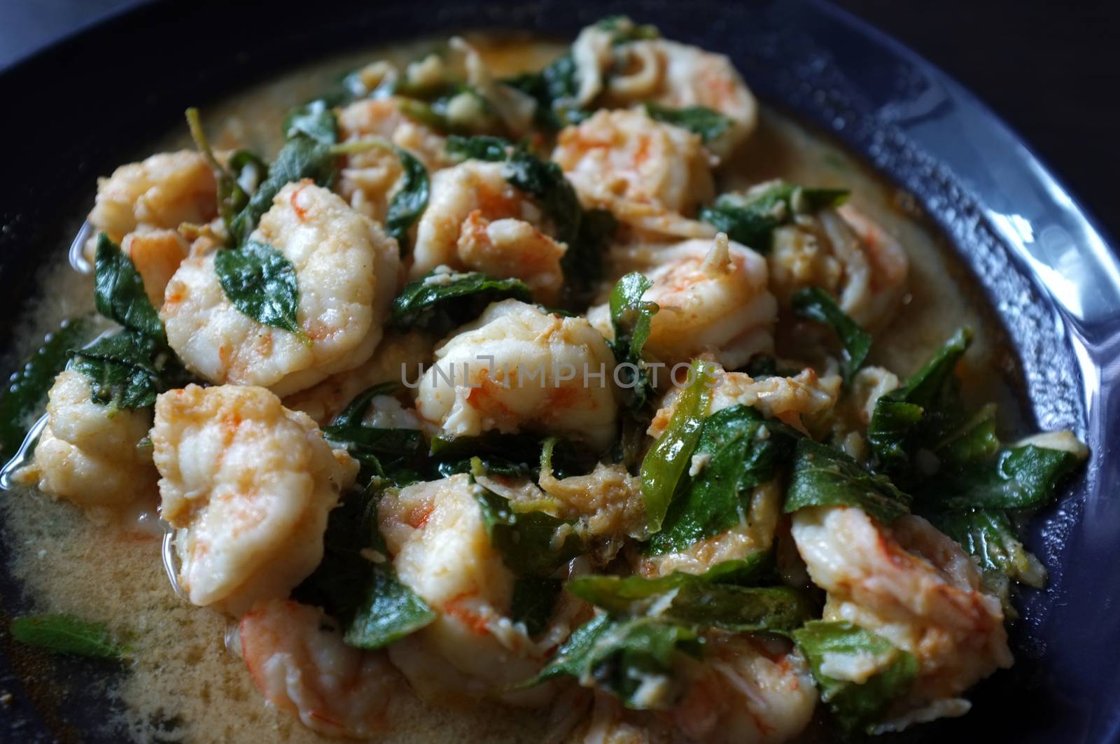 Thai food, shrimp ,with chili pepper and Thai basil.