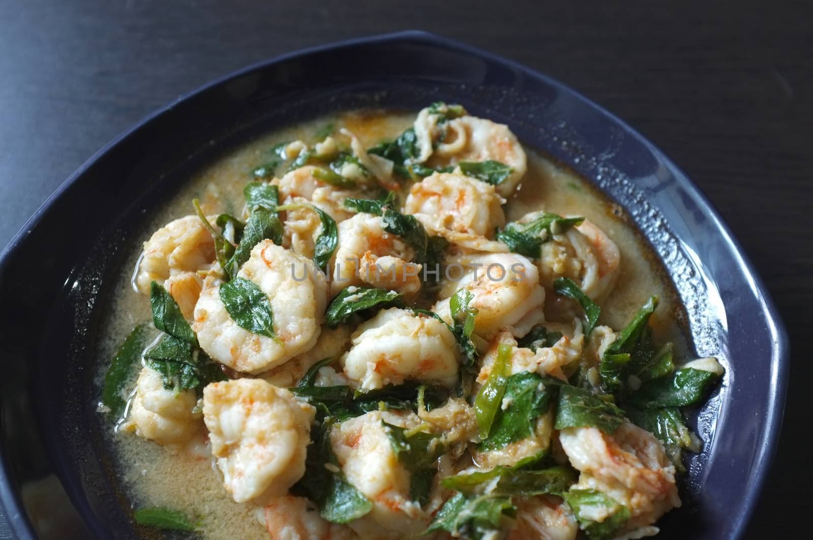 Thai food, shrimp ,with chili pepper and Thai basil.