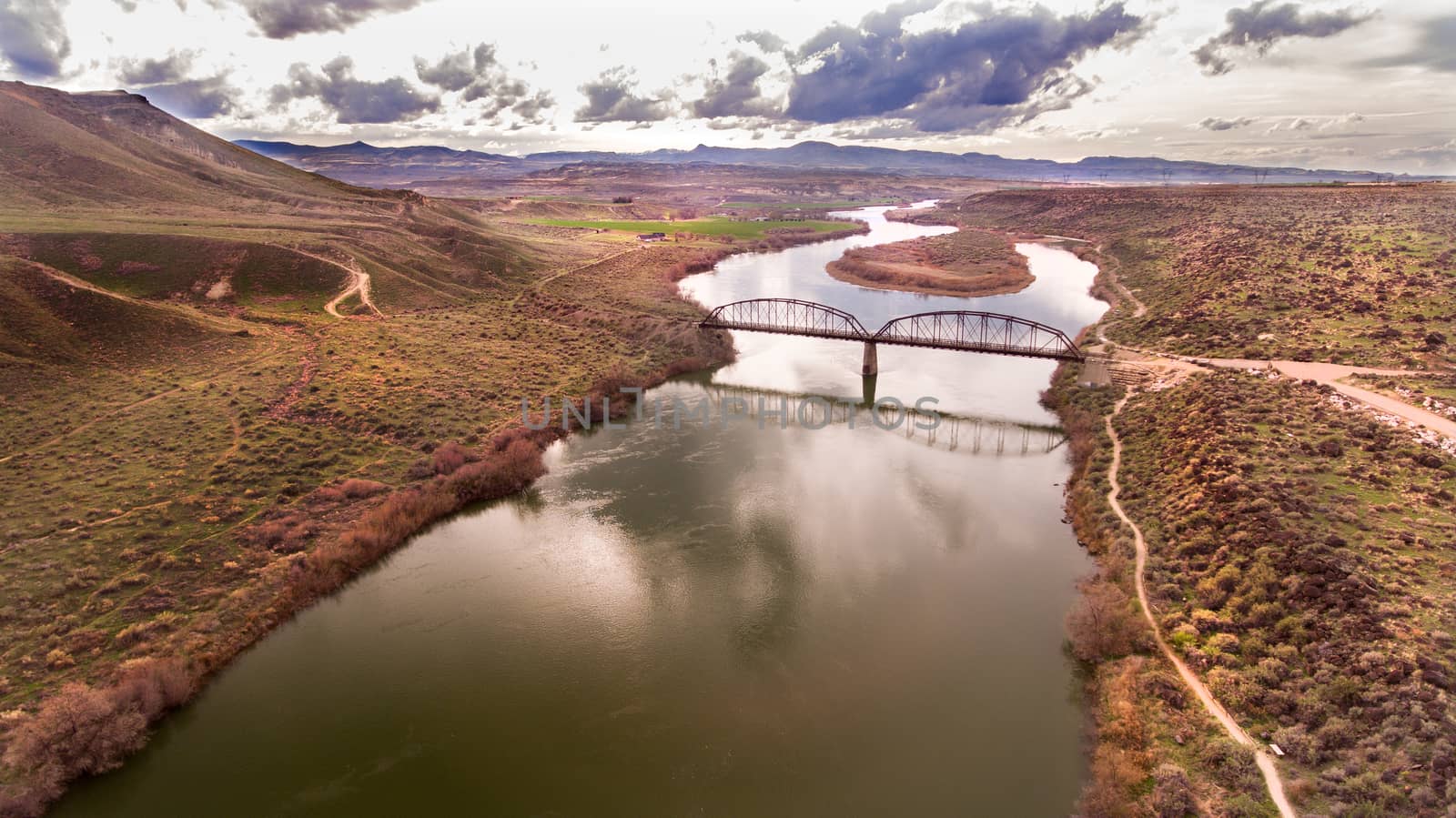 aerial view of a bridge going over a river in idaho