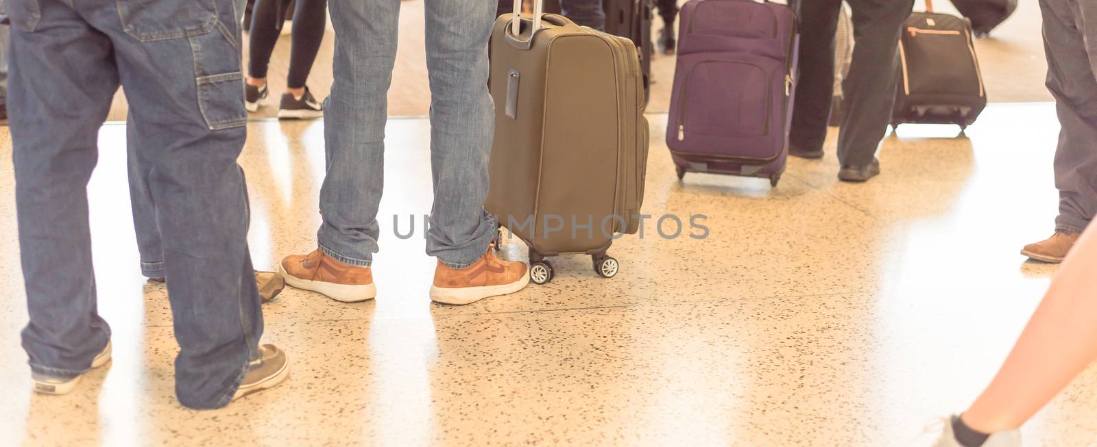 Panoramic close-up back view crowded group of traveler waiting to onboard at Seattle airport by trongnguyen