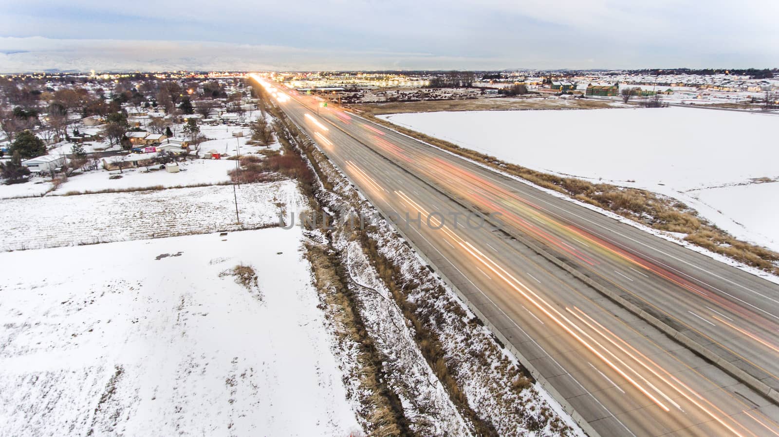 Traffic moving fast and showing motion blur during winter time