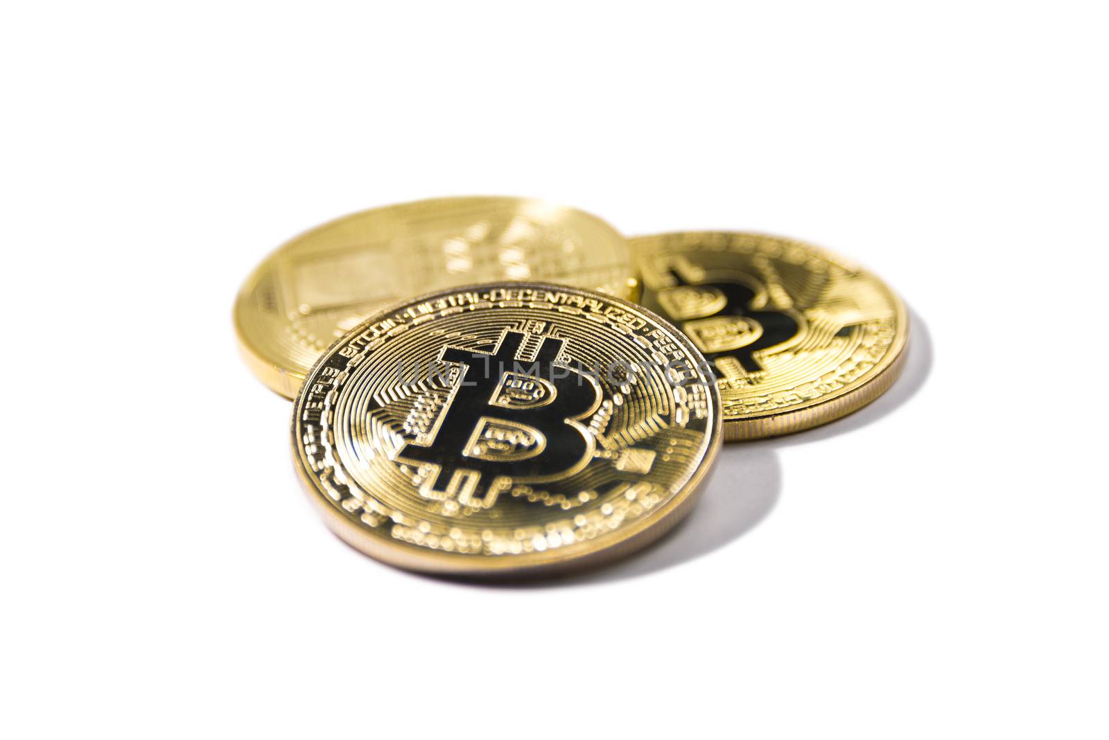 Golden Bitcoin coin on white background. Cryptocurrency. by butenkow