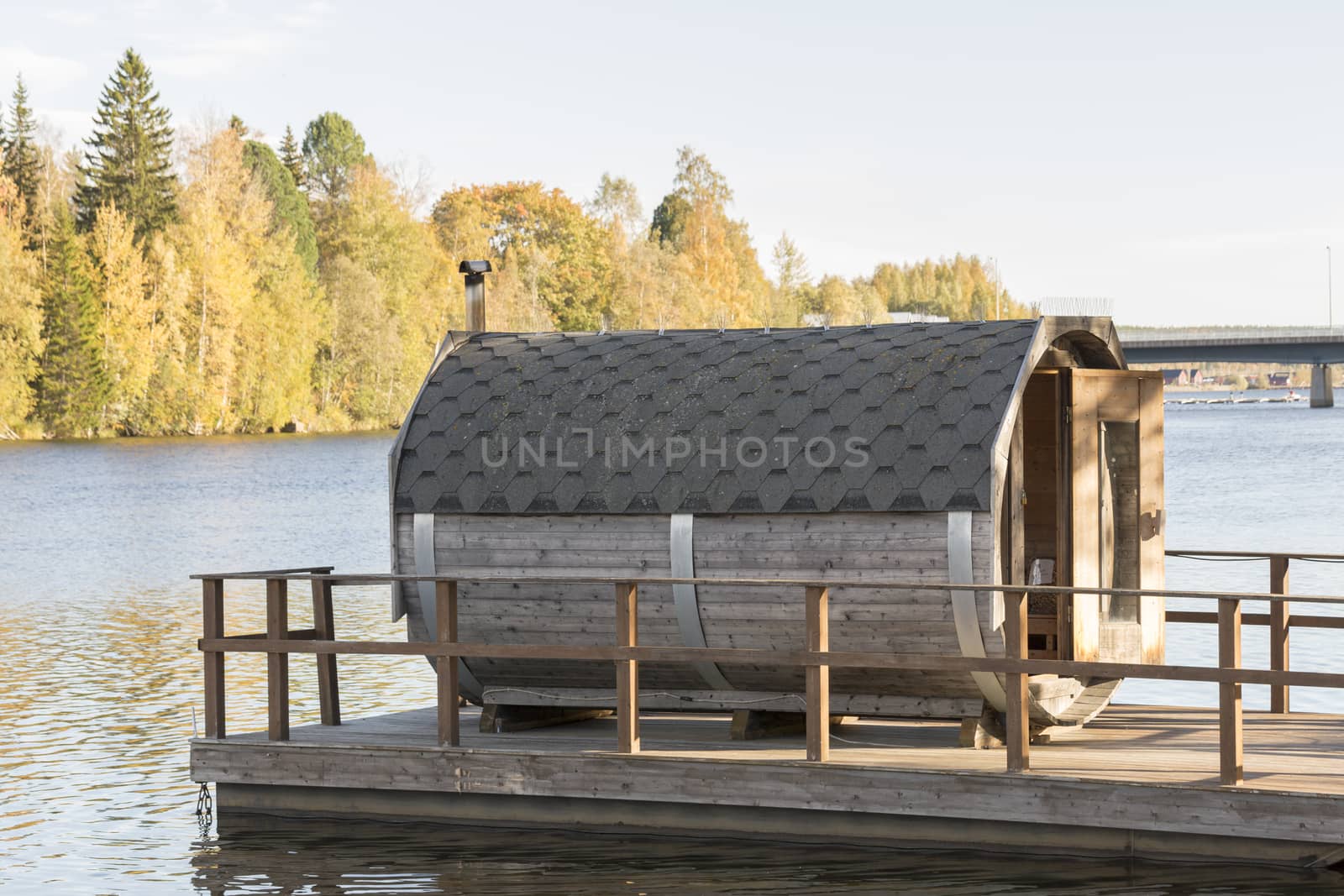 Sauna Floating on River in autumn.