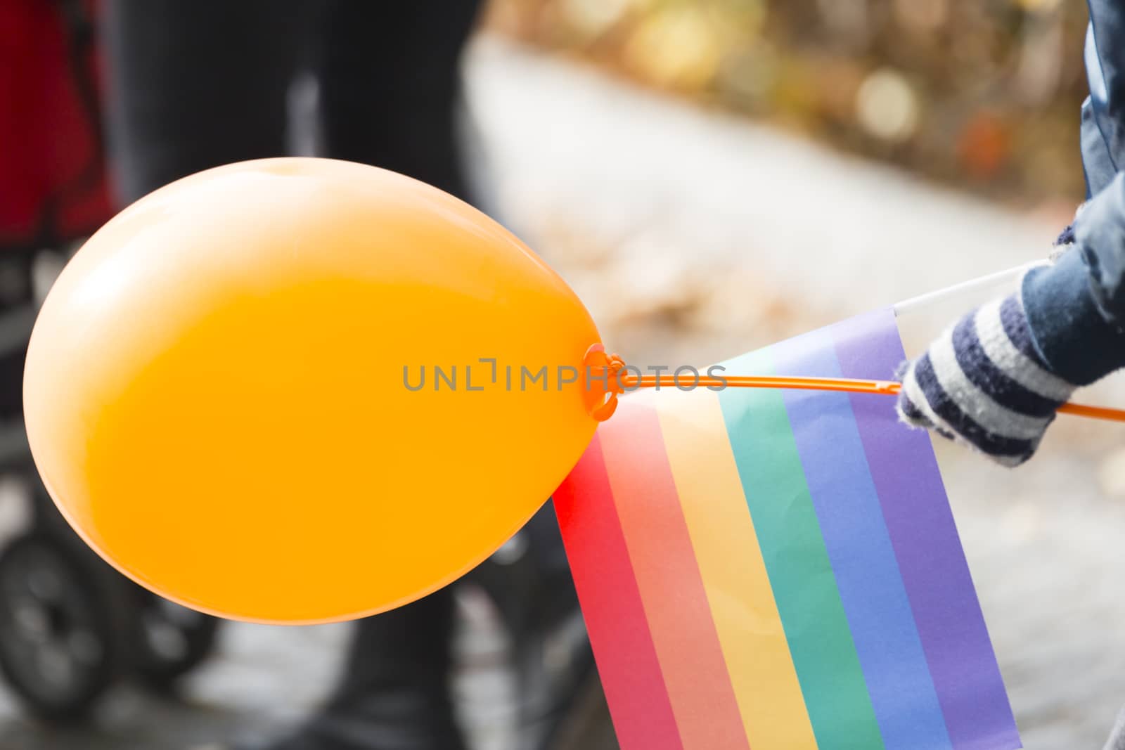 Child with Balloon and Ranbow Flag.