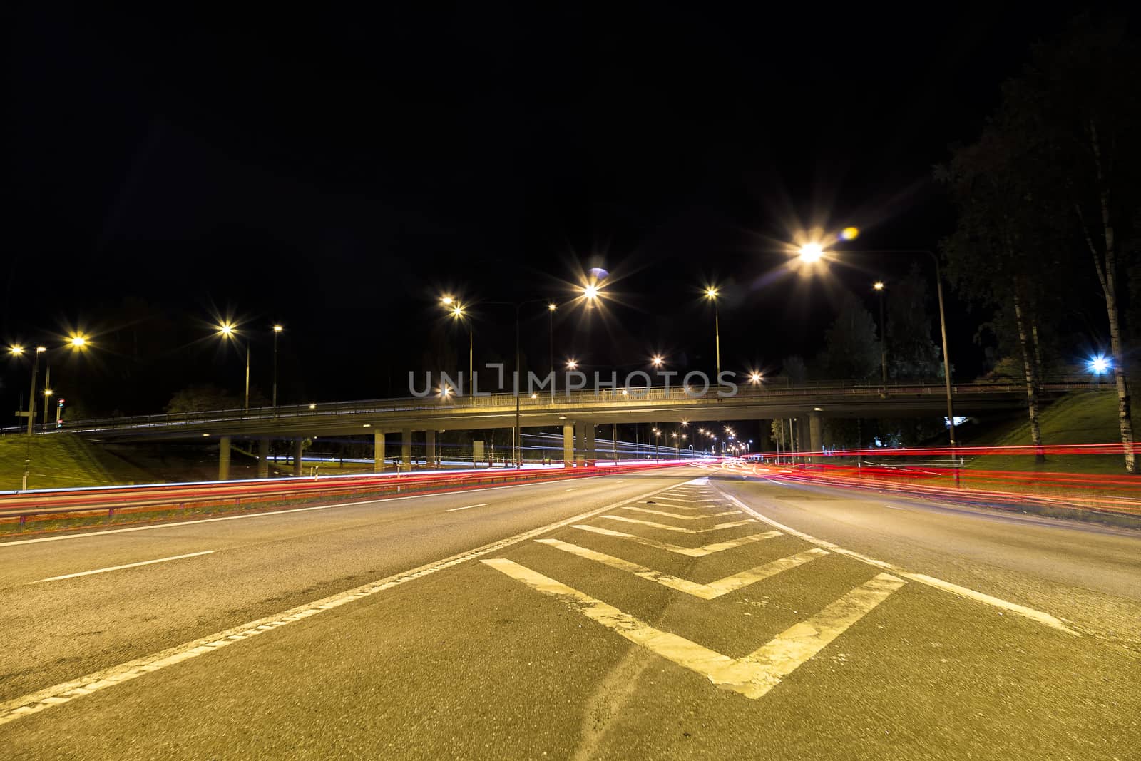 Highway in Sweden with light trails at night.
