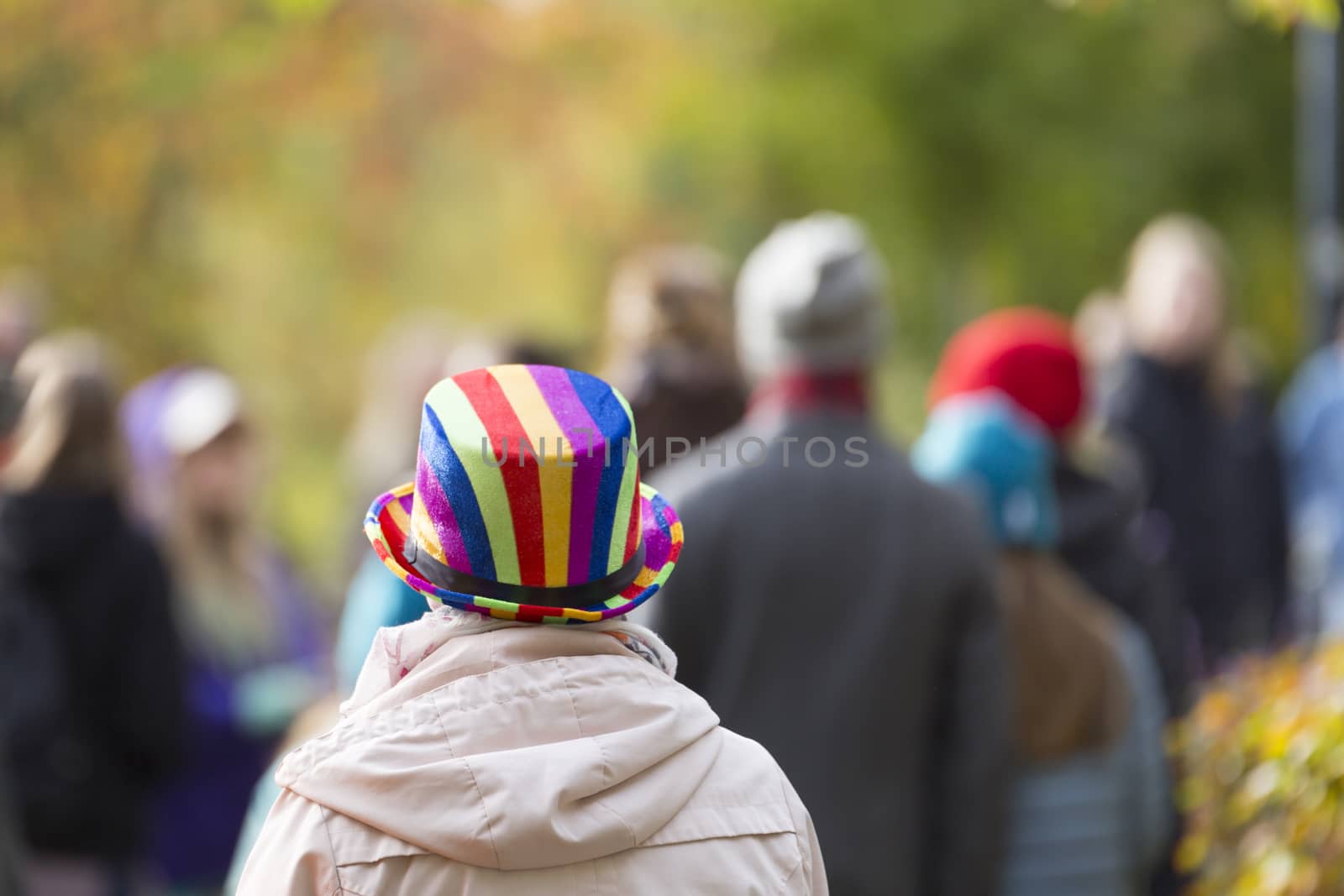 Female with Rainbow Coloured Hat in Pride Parade.