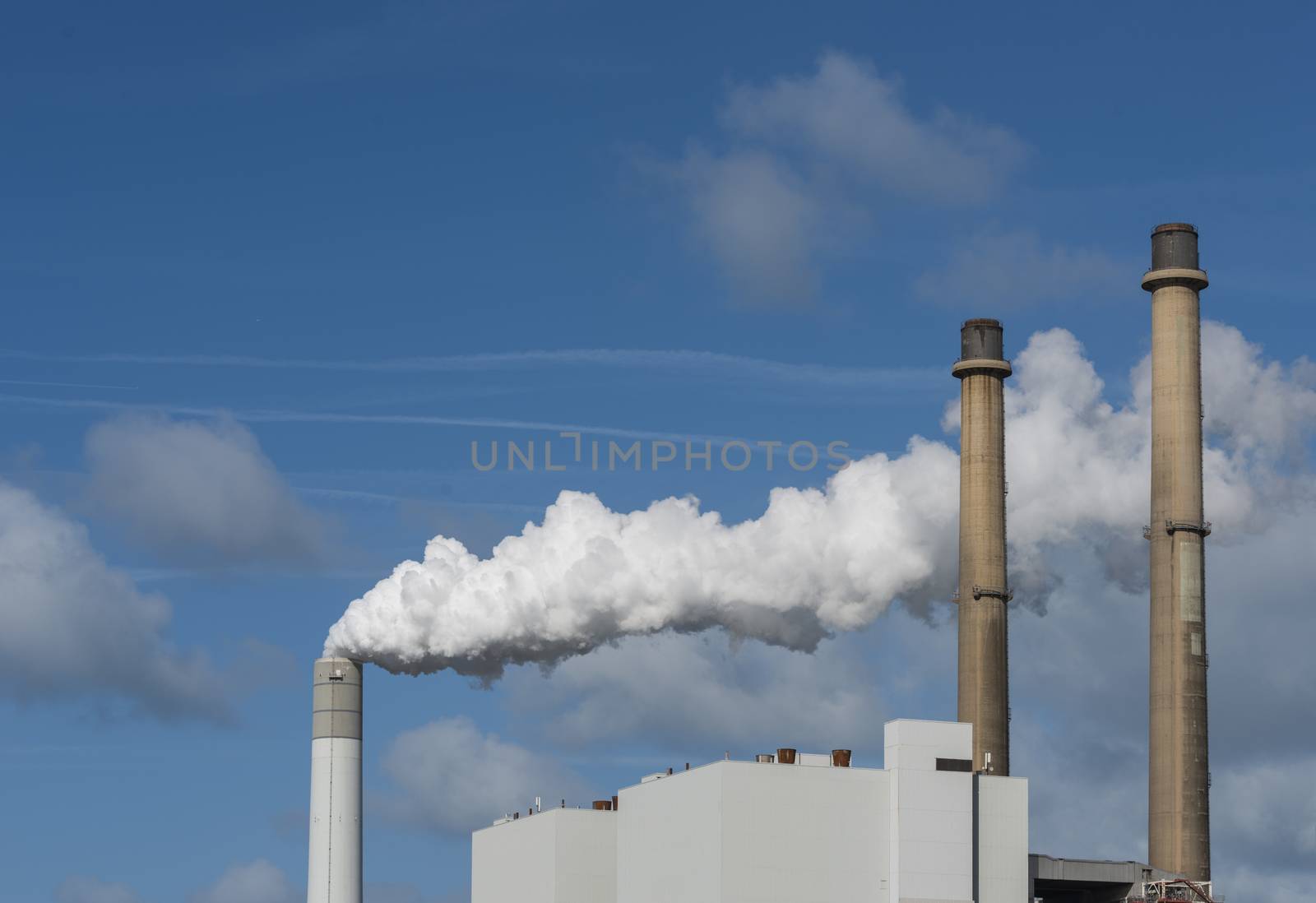 smoke pollution of a power plant in holland near rotterdam in the area europoort