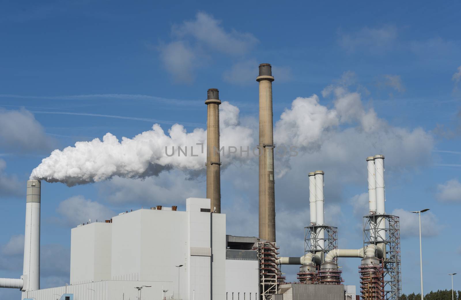 smoke pollution of a power plant in holland near rotterdam in the area europoort