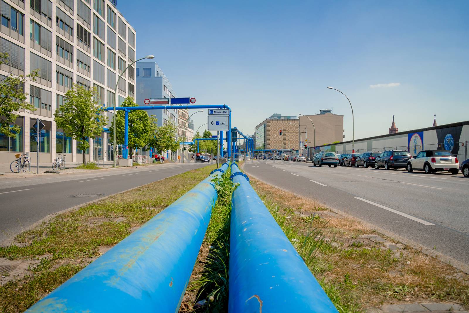 Blue pipes at the street of Berlin city. The pipes are used to pump water away from construction sites due to the city's high groundwater level.