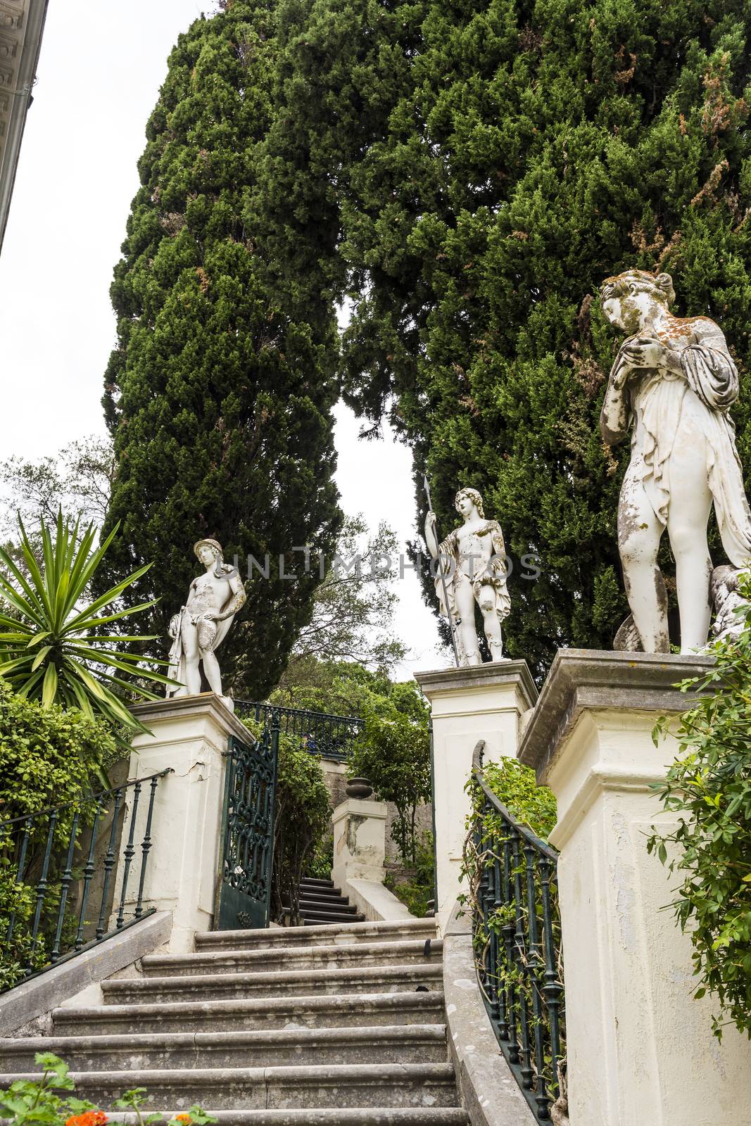 Achilleion palace, Corfu, Greece - August 24, 2018: Classical statues at the Achillion Palace on the island of Corfu.