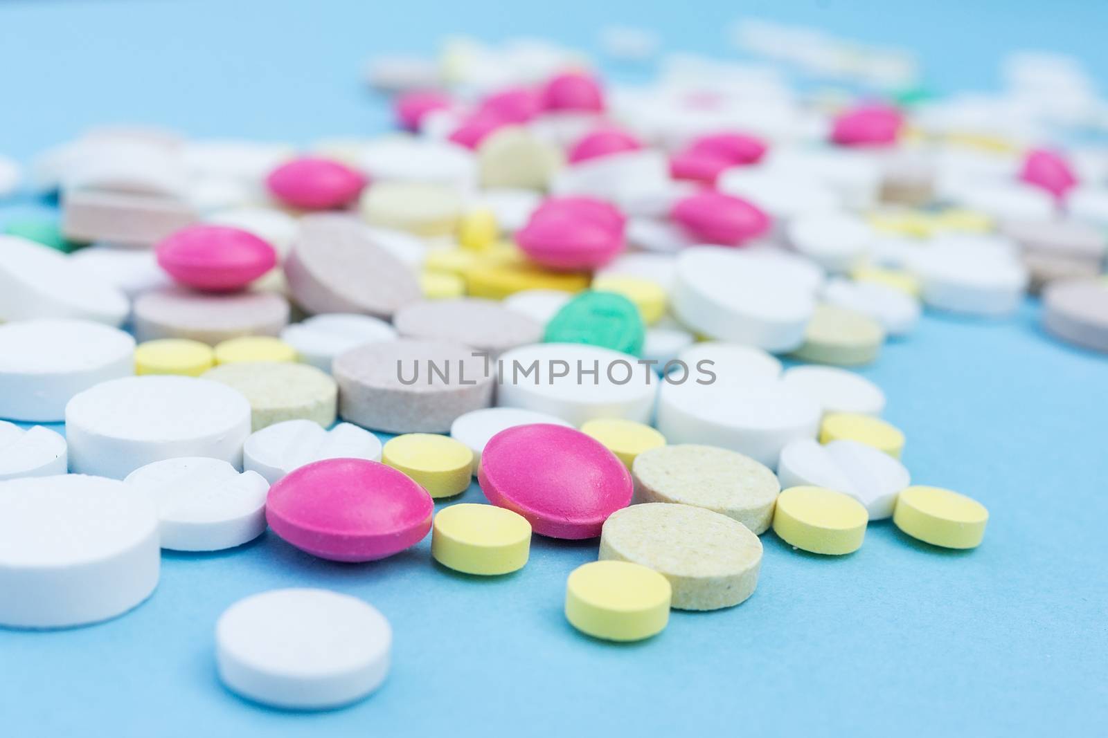 pills on a blue background by AlexBush