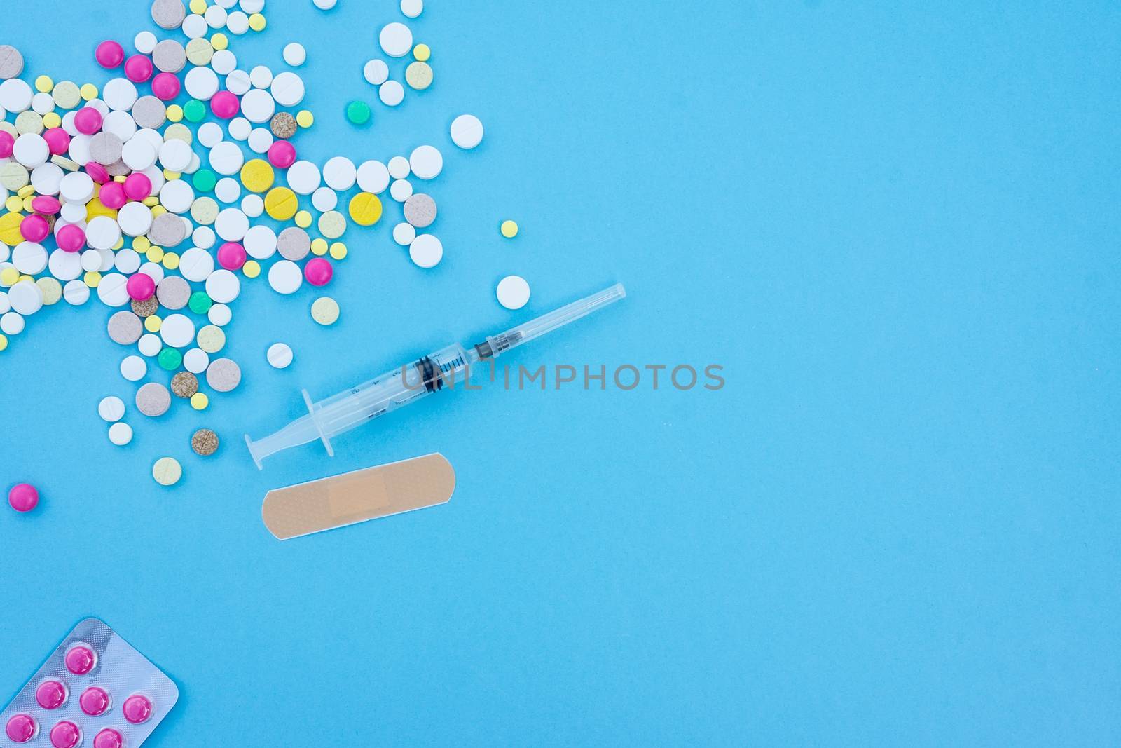 pills on a blue background by AlexBush