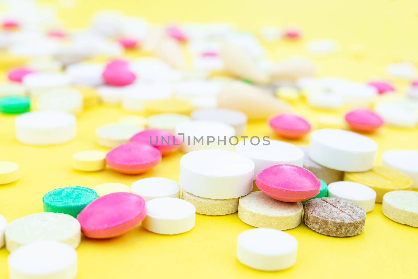 pills on a yellow background by AlexBush