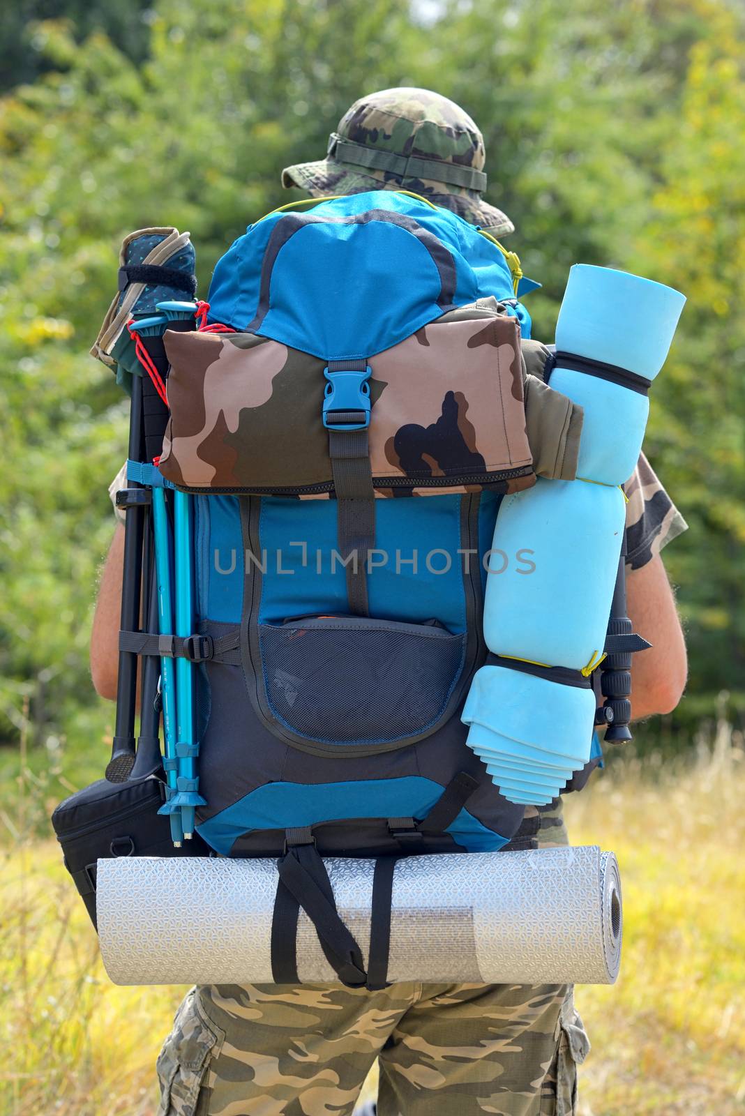 Hiker with a backpack in the mountains