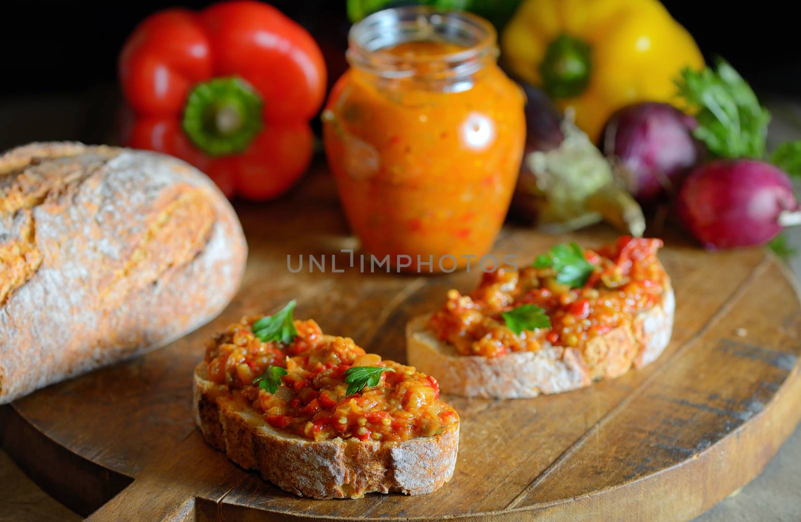 Homemade vegetable salad and bread on wooden table