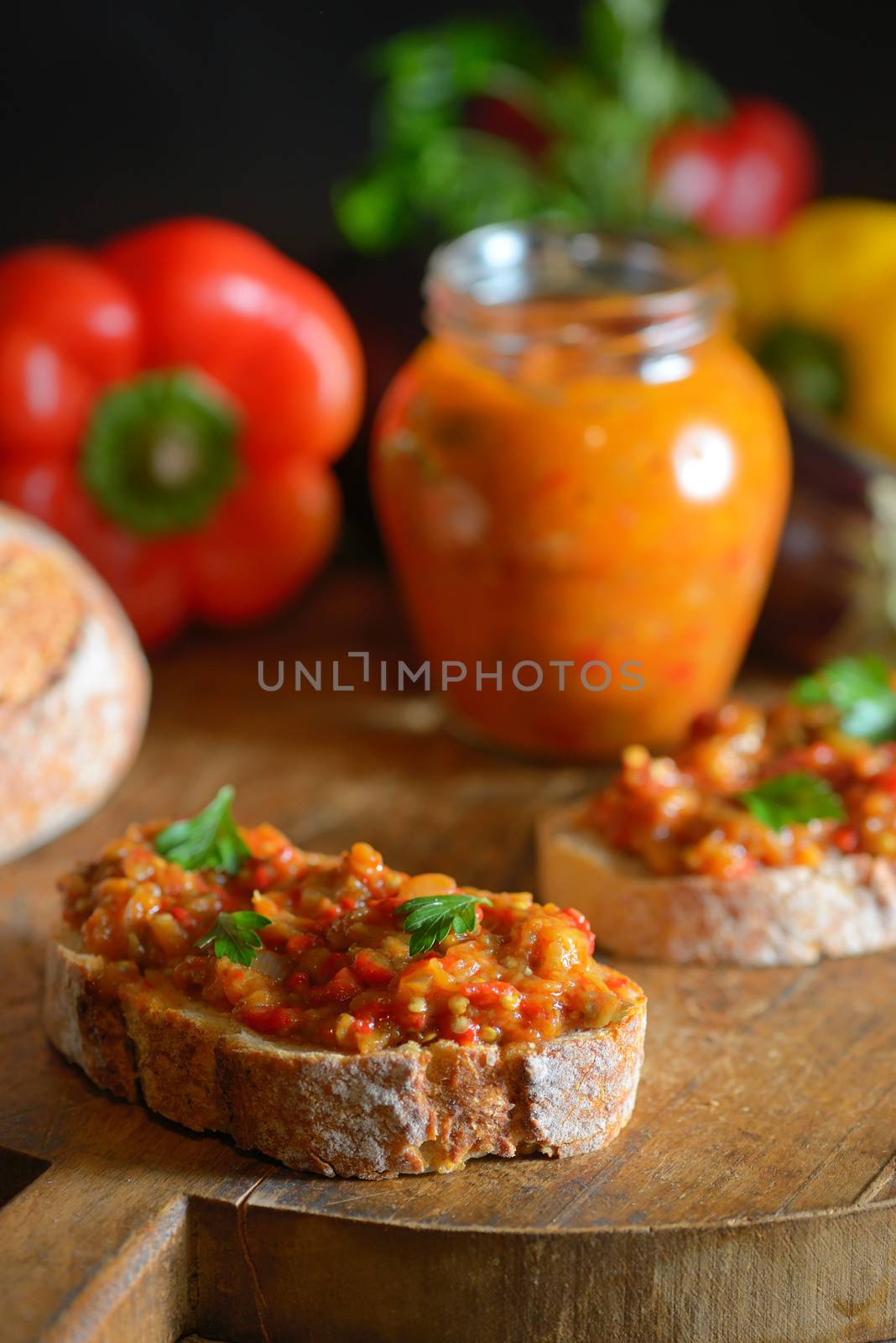 Homemade vegetable salad and bread on wooden table