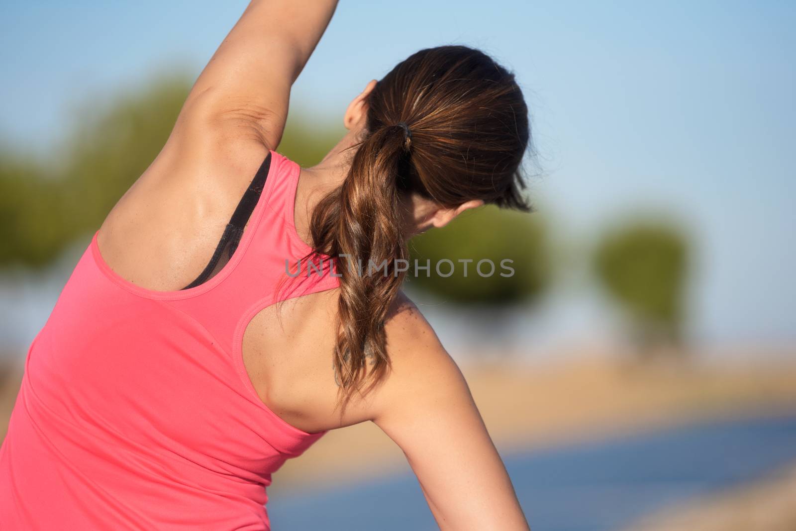 woman doing stretching exercise for back, sport background. by HERRAEZ