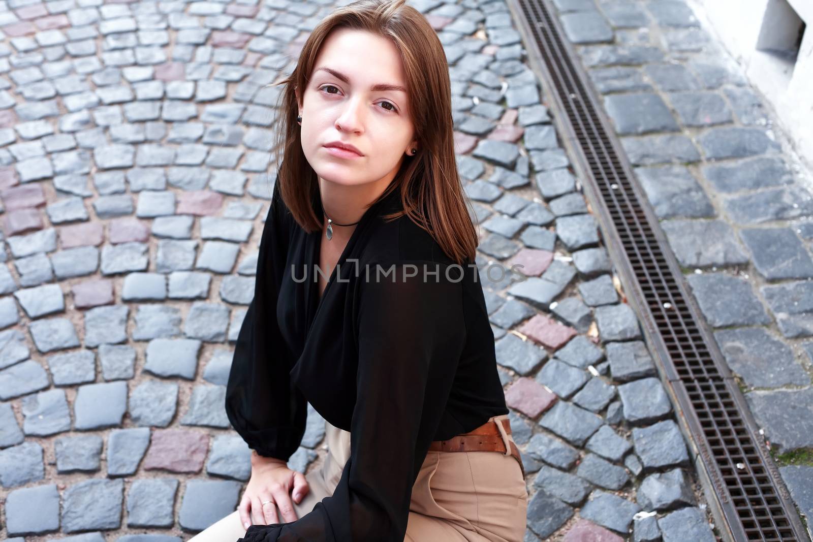 Beauty young woman against nice gray pavement background