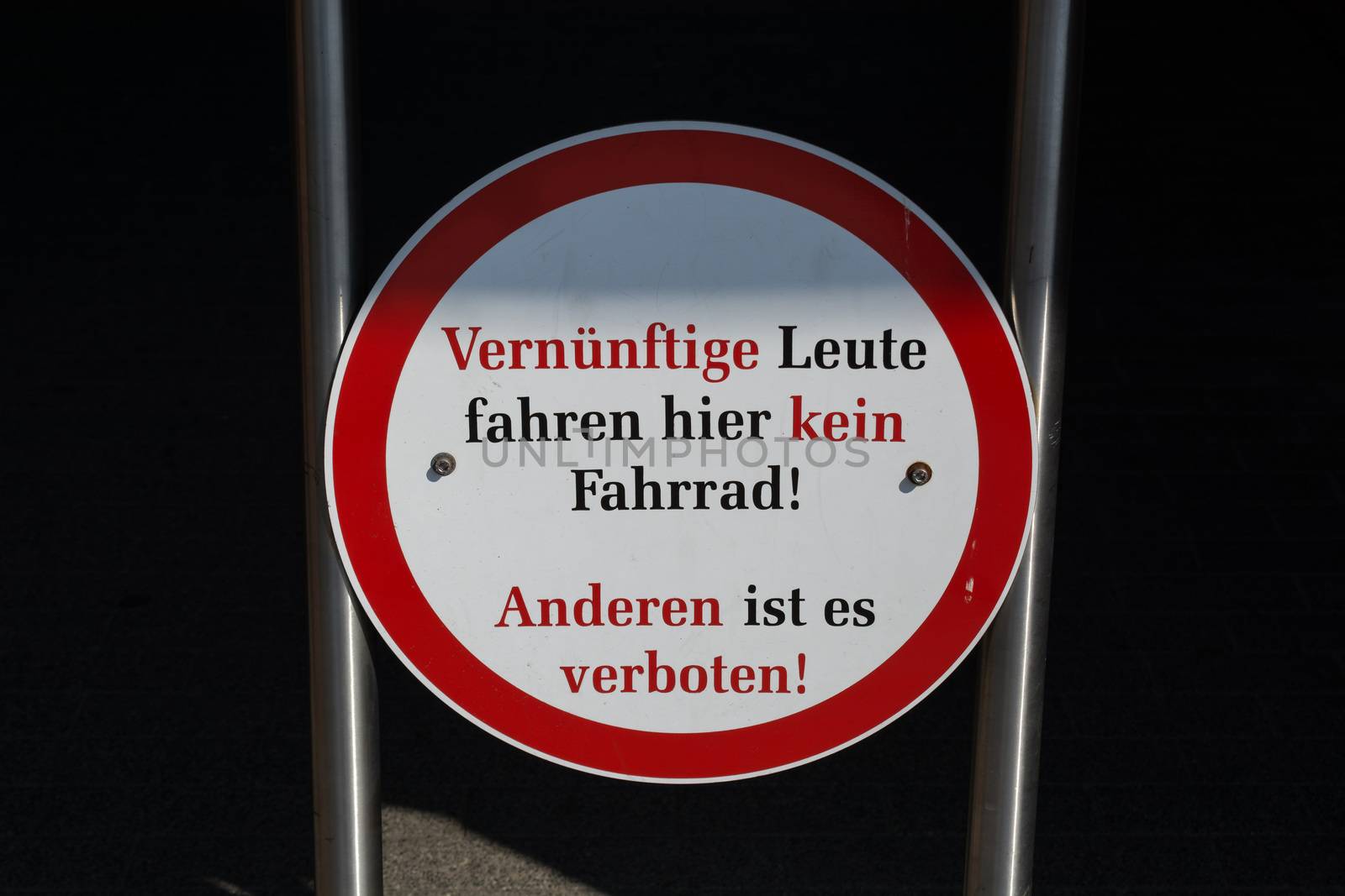 Traffic signs with inscription in German - Reasonable people do not ride a bicycle here, other people it is forbidden