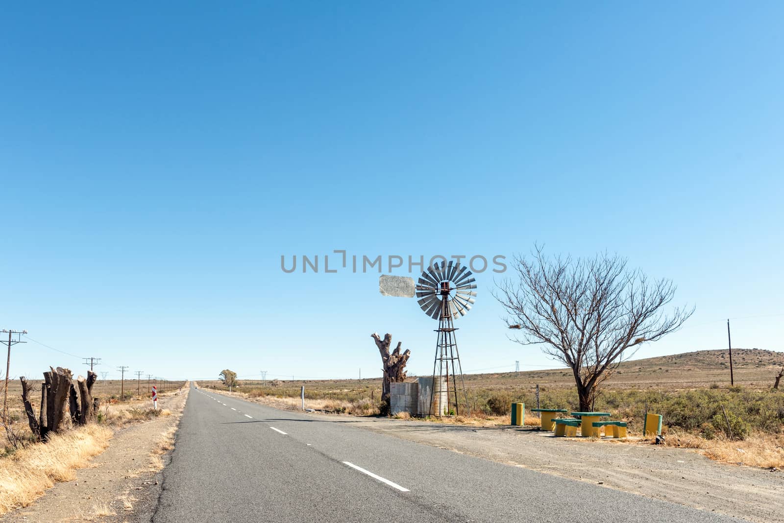 A water-pumping windmill and picnic spot on road R48 between Phillipstown and De Aar in the Northern Cape Province
