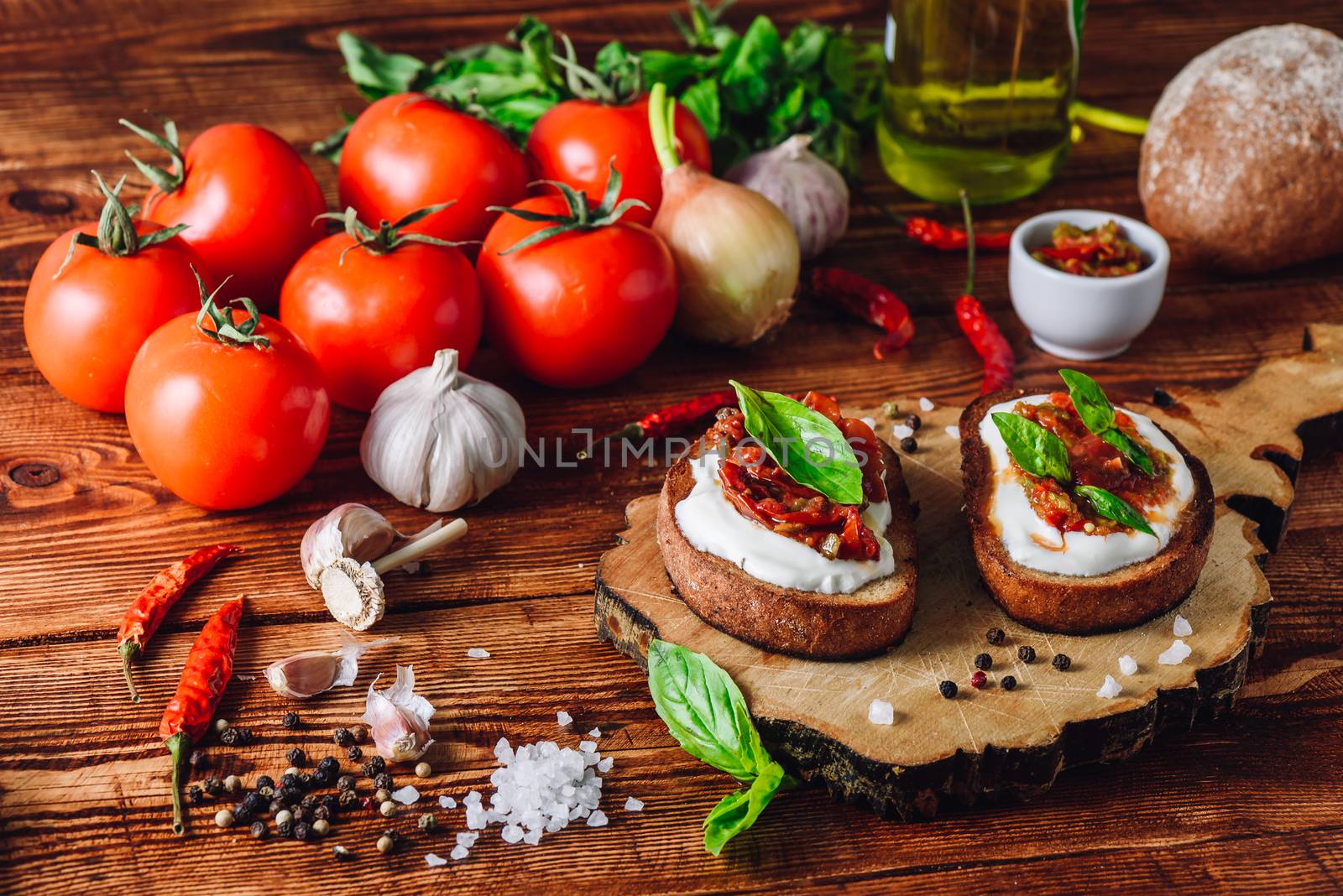 Two Bruschettas with Tomatoes and Spicy Sauce by Seva_blsv