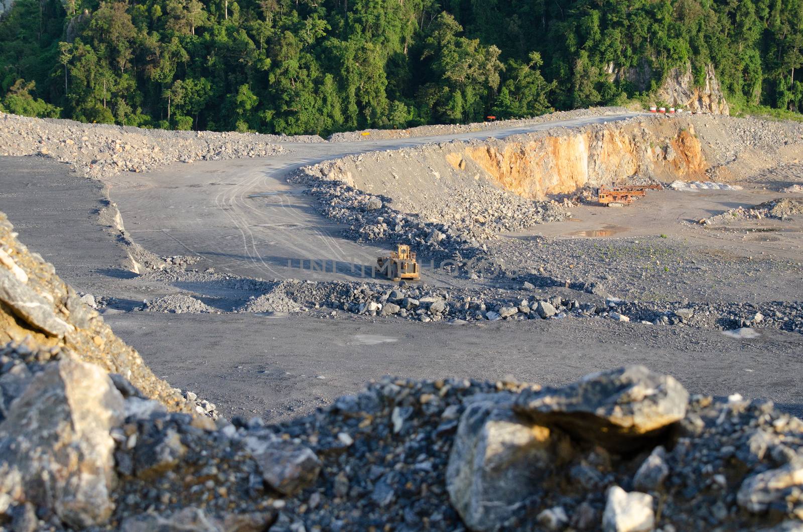 Open pit mine, digging for limestone by visanuwit