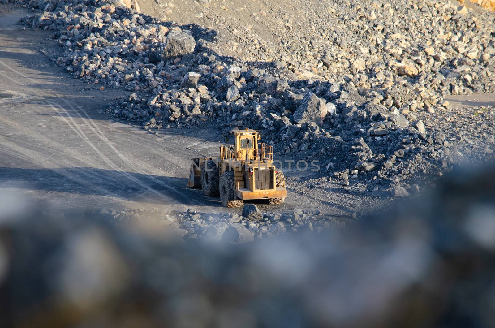 Open pit mine, digging for limestone by visanuwit