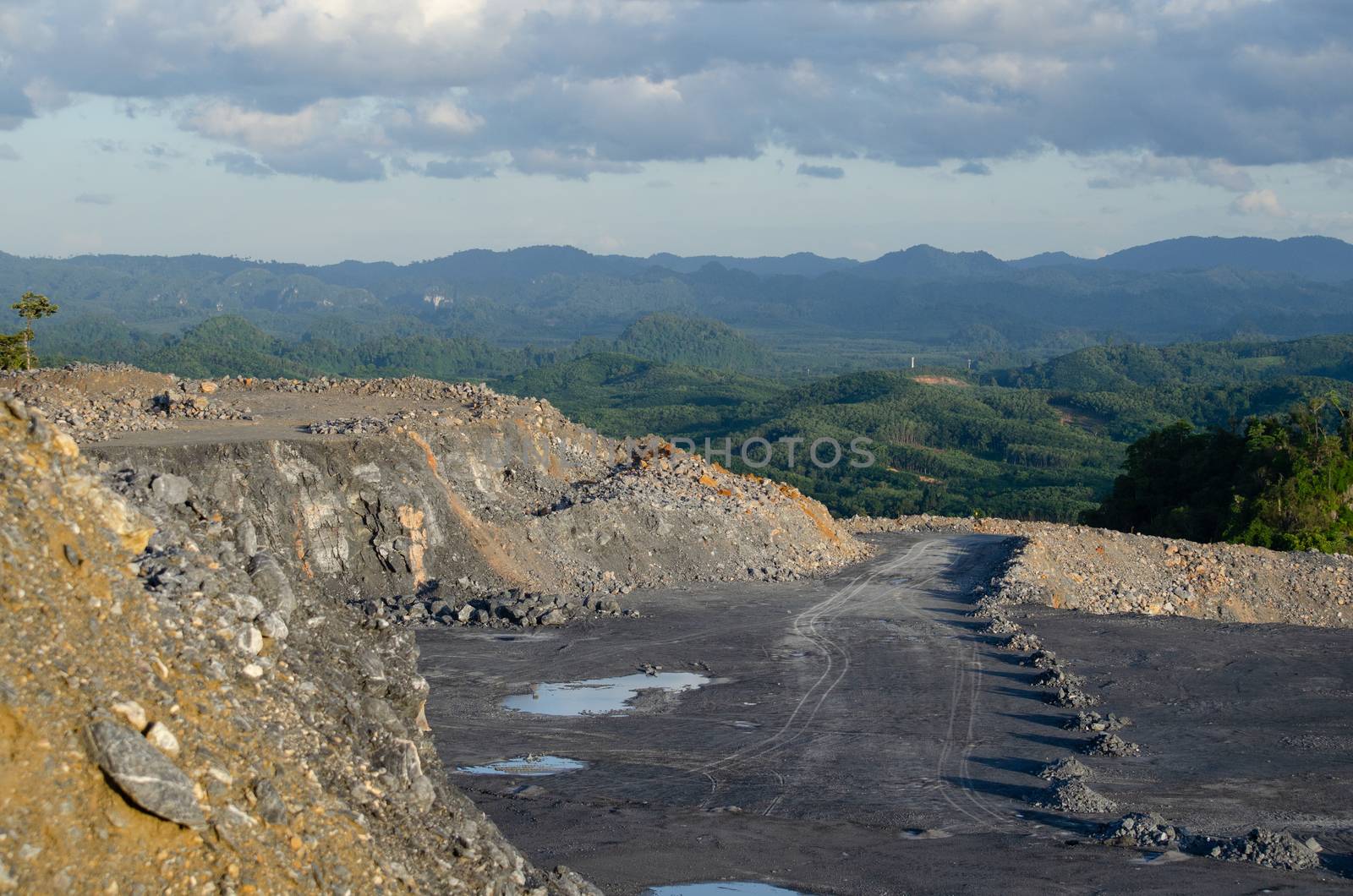 Open pit mine, digging for limestone by visanuwit