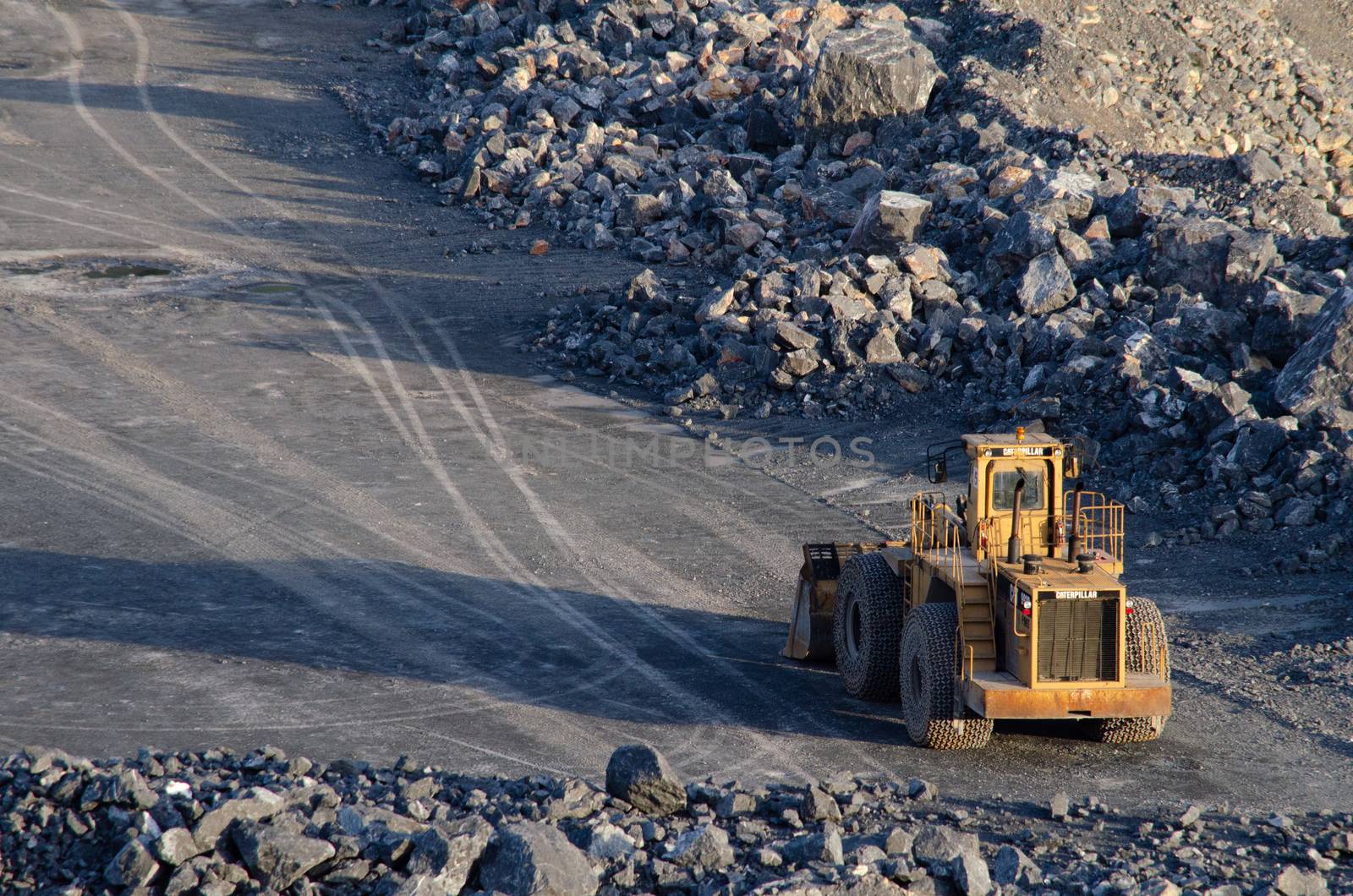 Open pit mine, digging for limestone by visanuwit