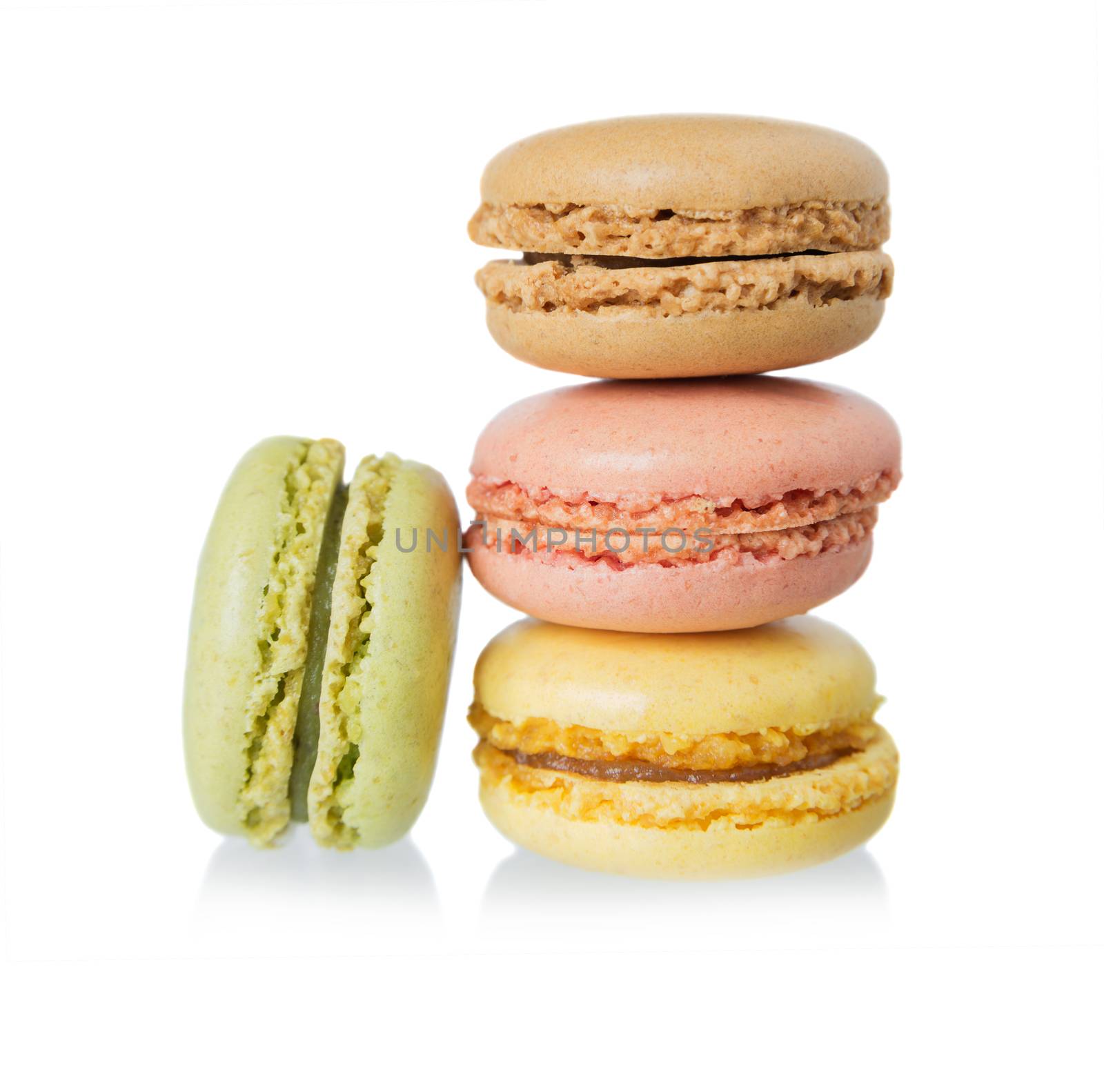 stack of several multicolored macaroons pastel colors isolated on white background