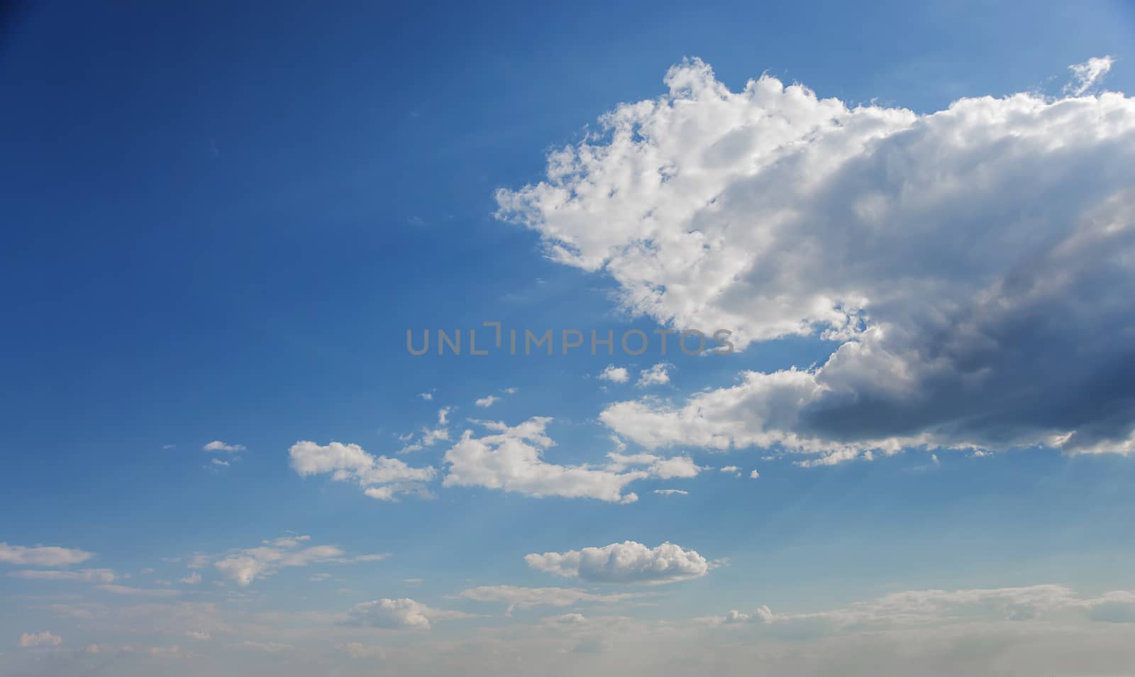 Beautiful natural background: blue sky with white clouds