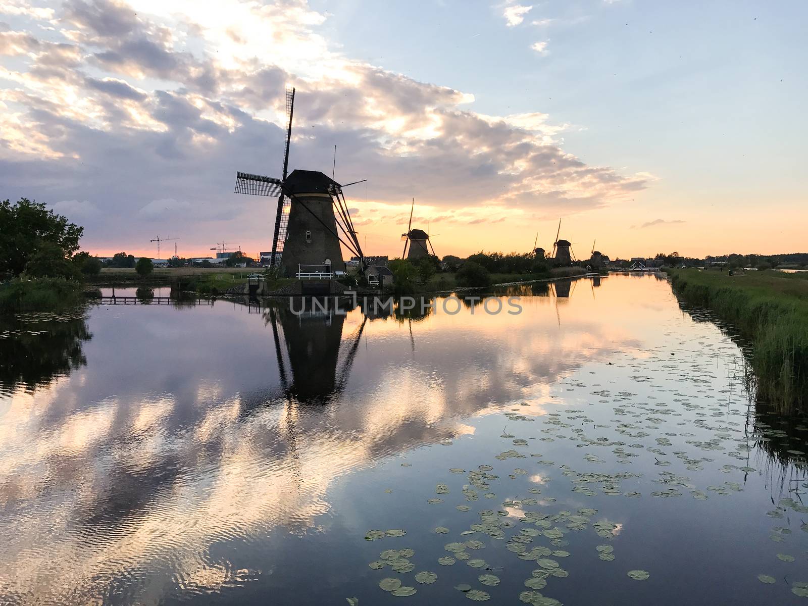 Beautiful dutch windmill landscape at the famous Kinderdijk canals, UNESCO world heritage site